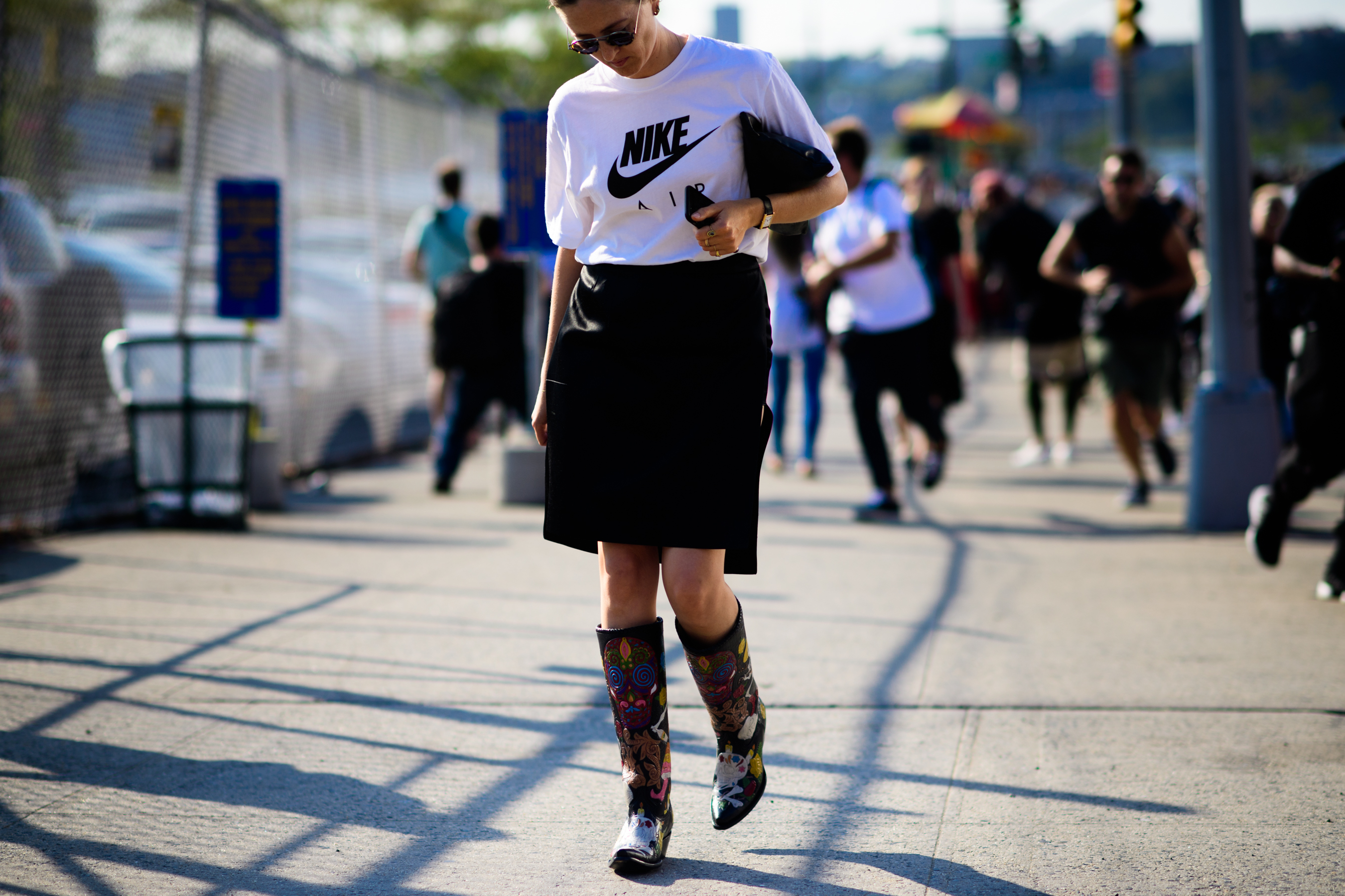 Woman wearing Nike and cowboy boots