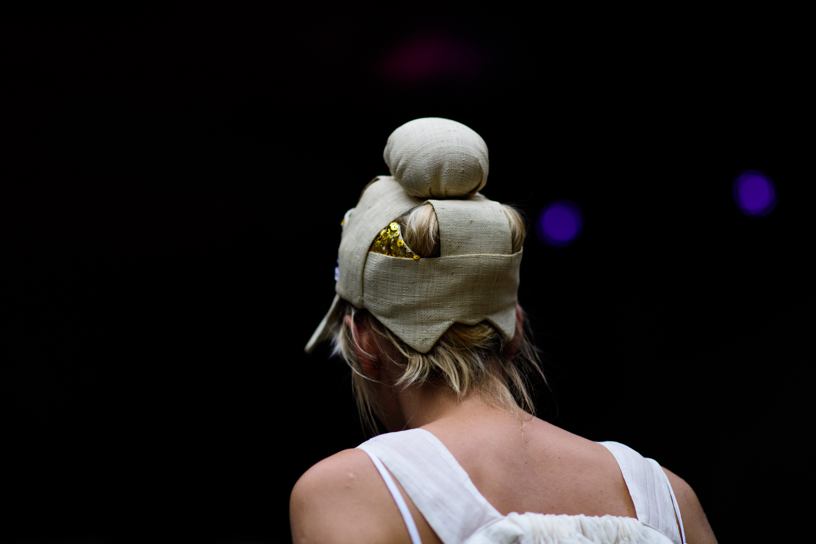 Woman wearing textile headpiece