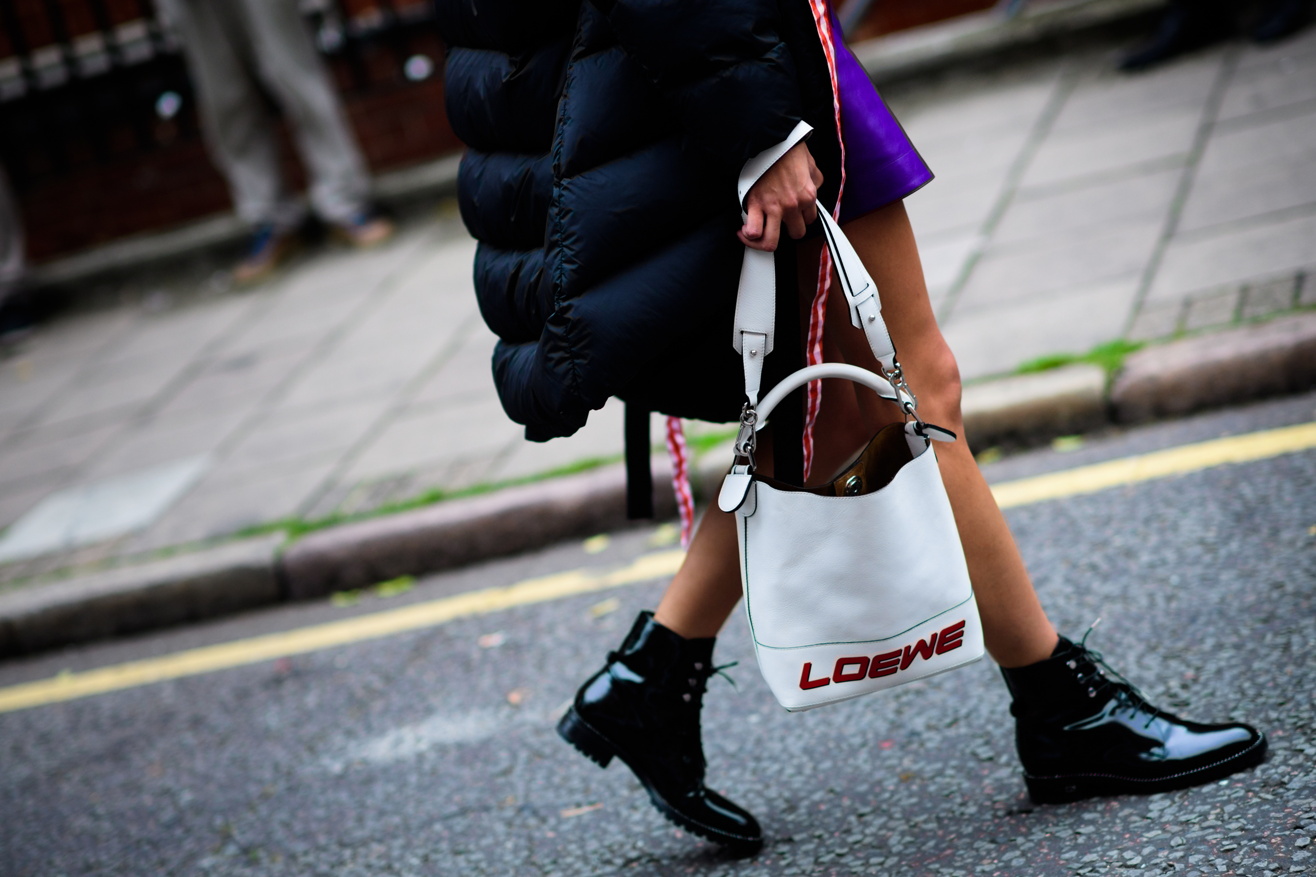 Woman with Loewe hand bag