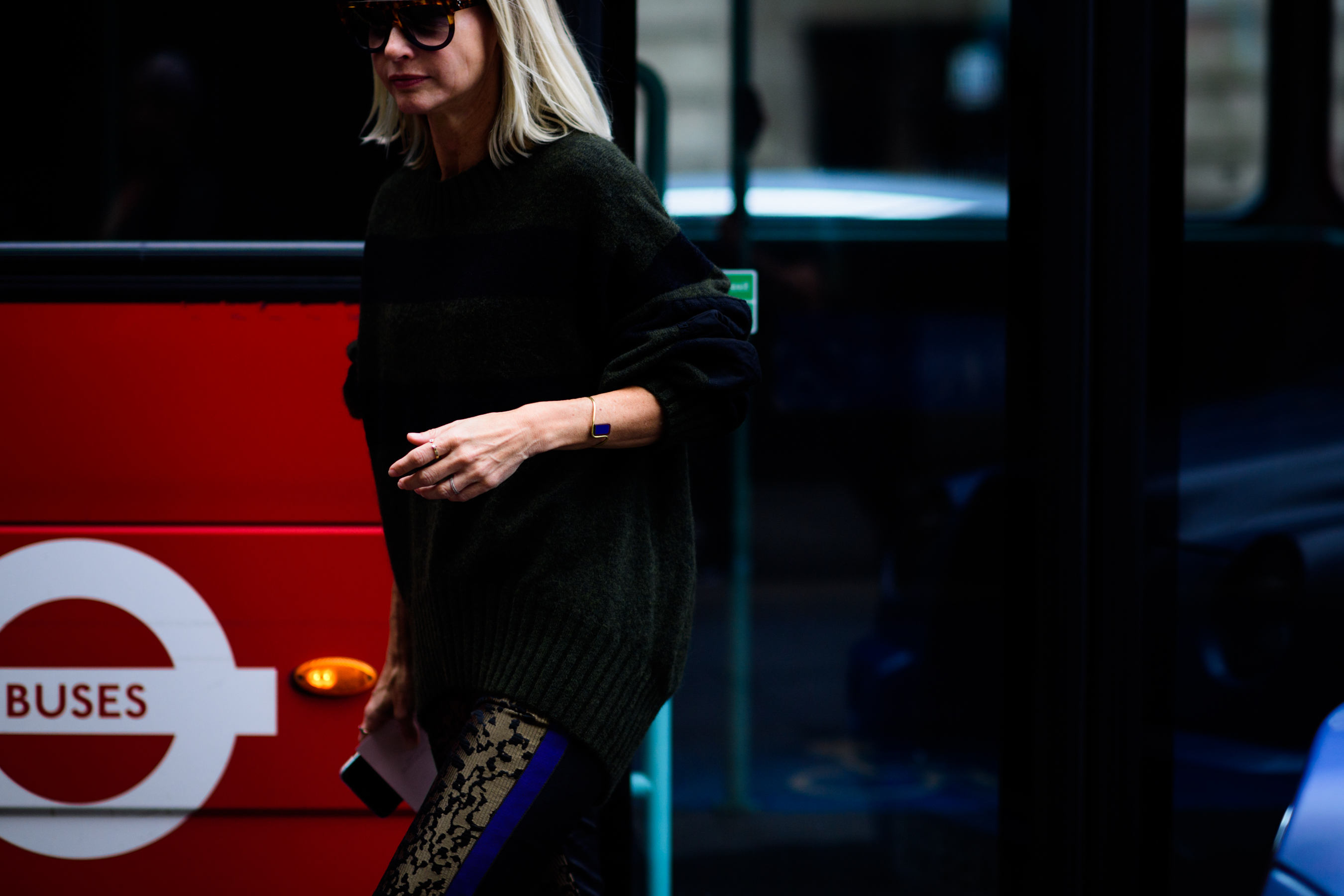 Woman wearing sunglasses and sweater