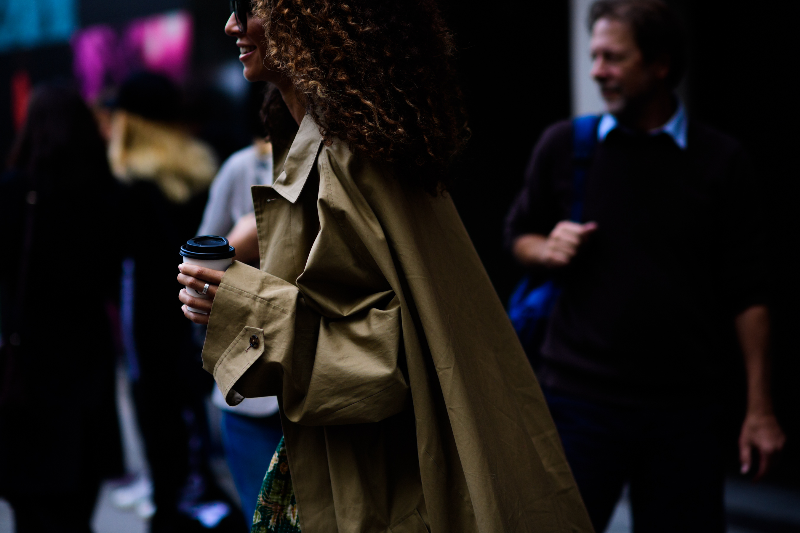 Woman wearing big khaki coat