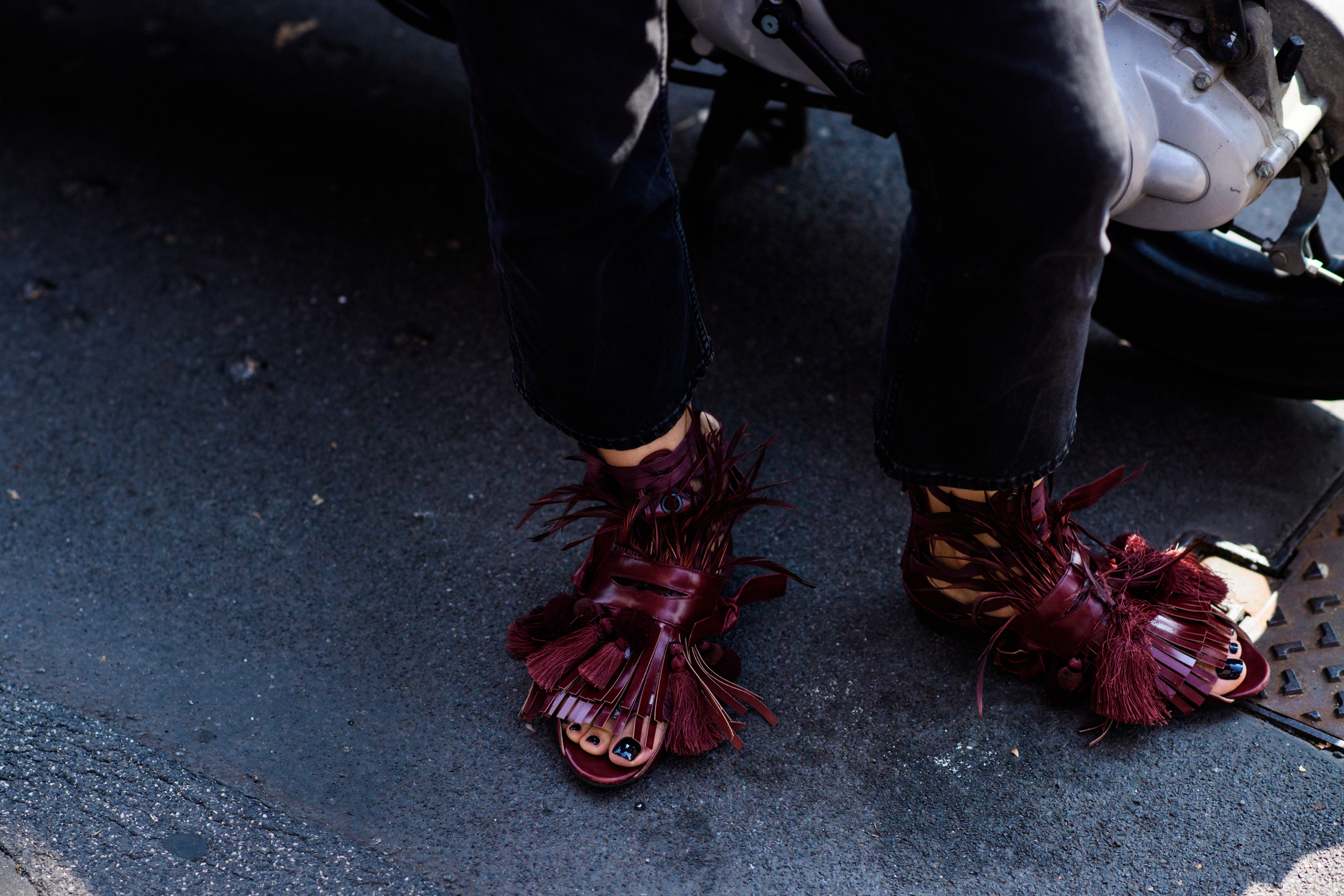 Woman wearing complex leather sandals