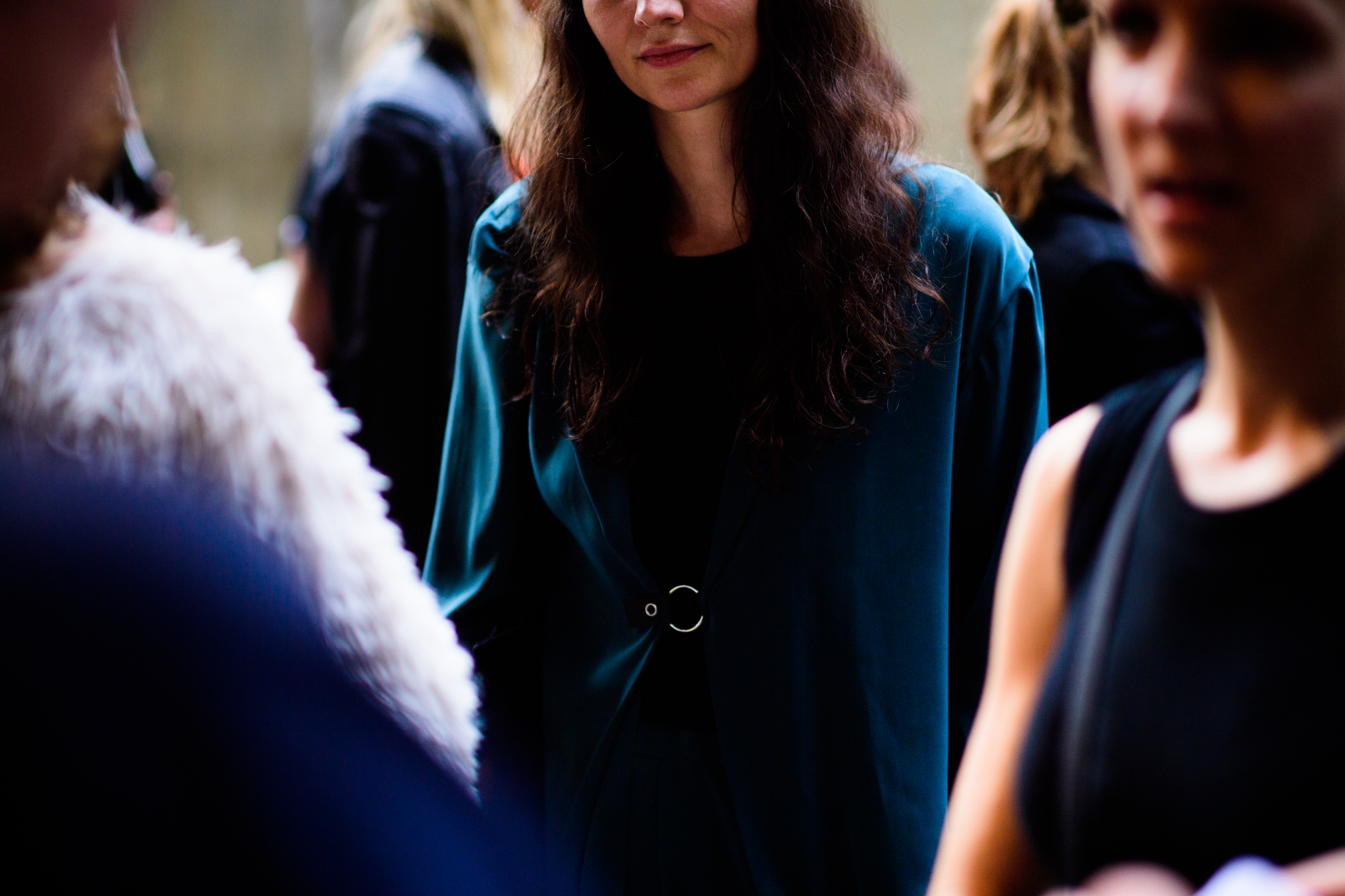 Woman wearing blue silk shirt