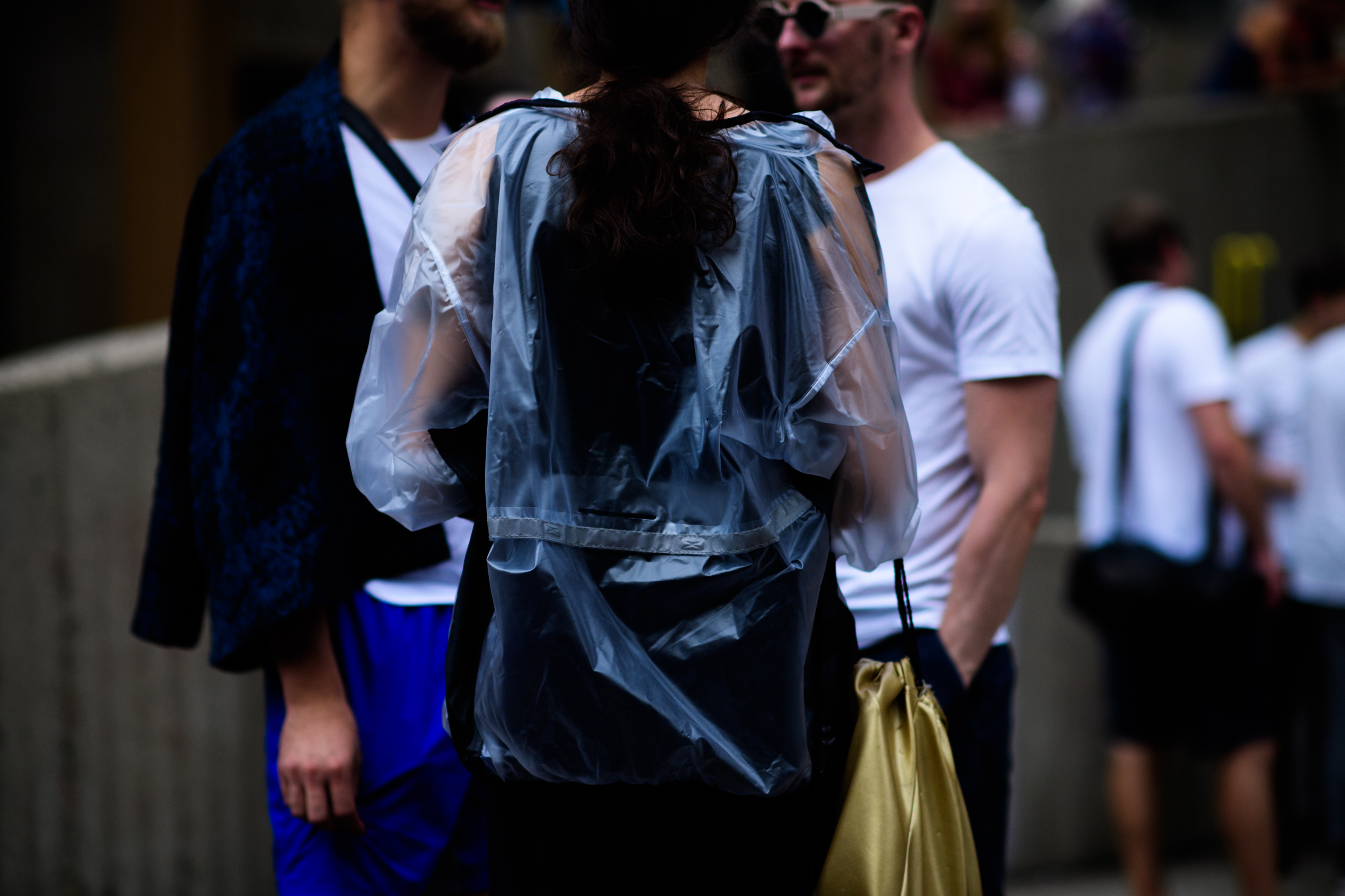 Woman wearing transparent rain jacket