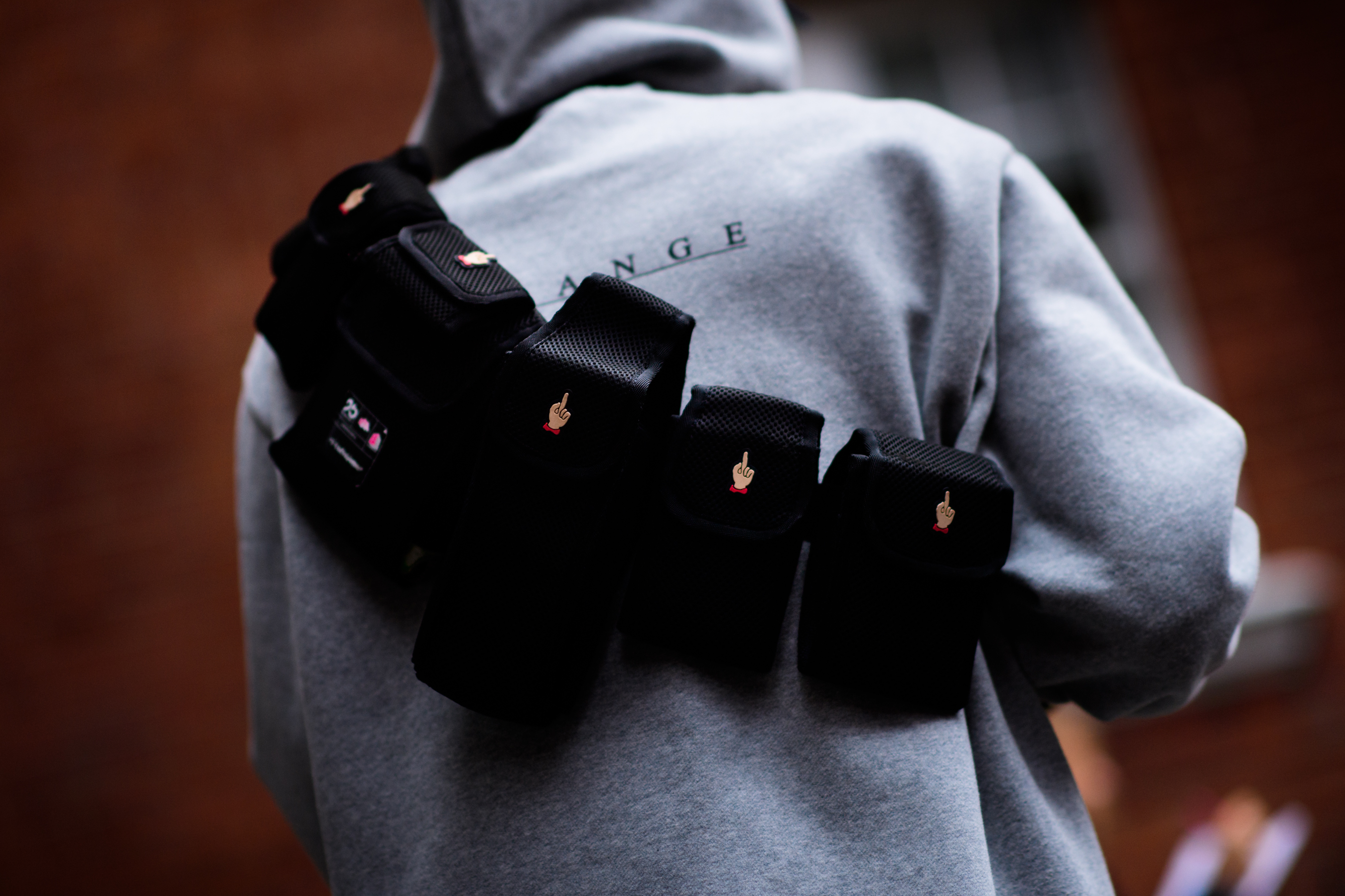 Korean photographer wearing Undercover utility belt