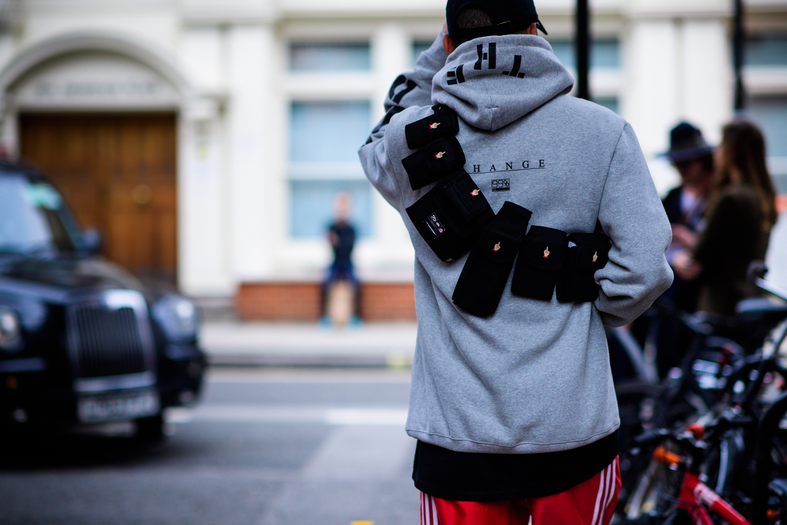 Korean photographer wearing Undercover utility belt