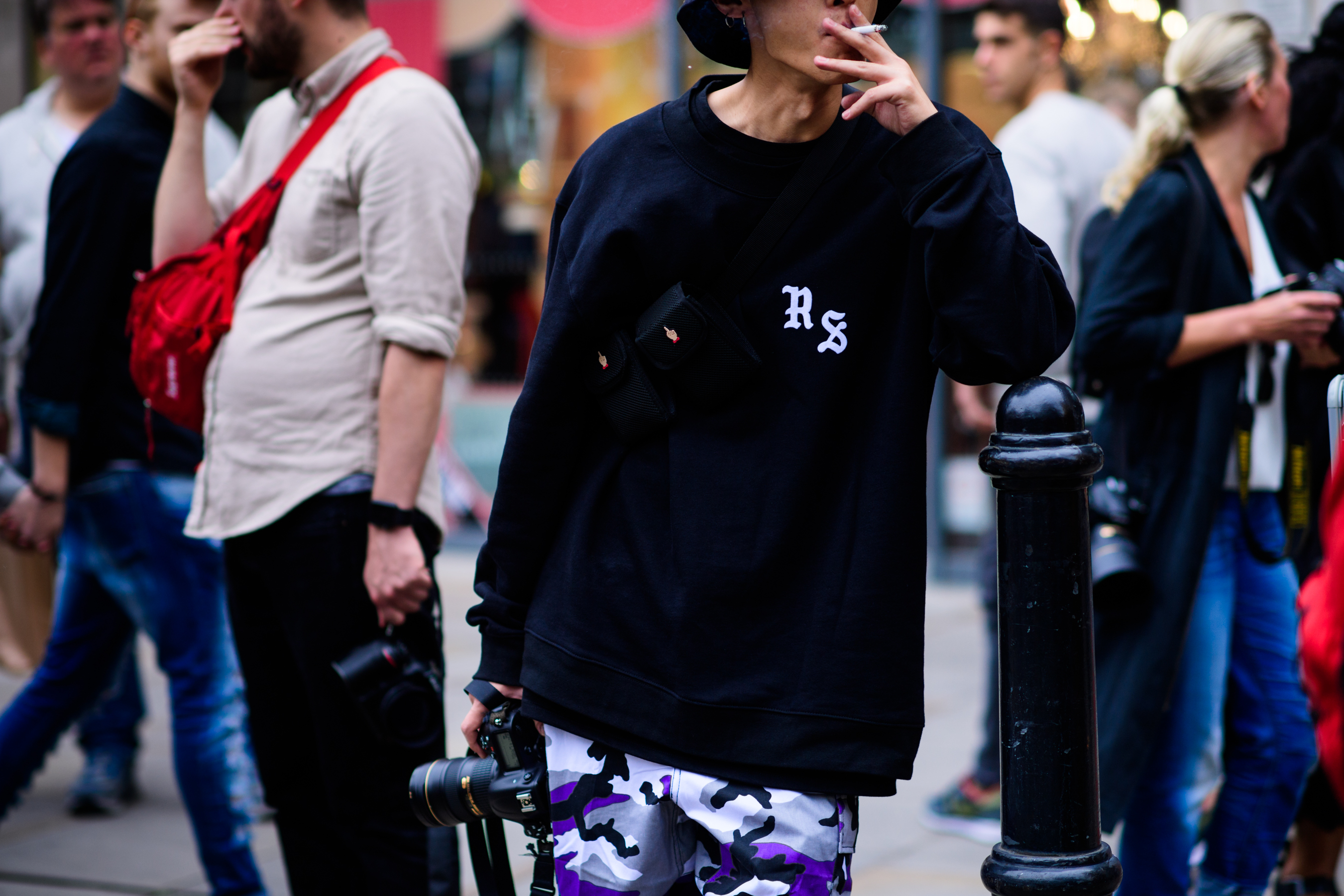 Korean photographer wearing camo pants