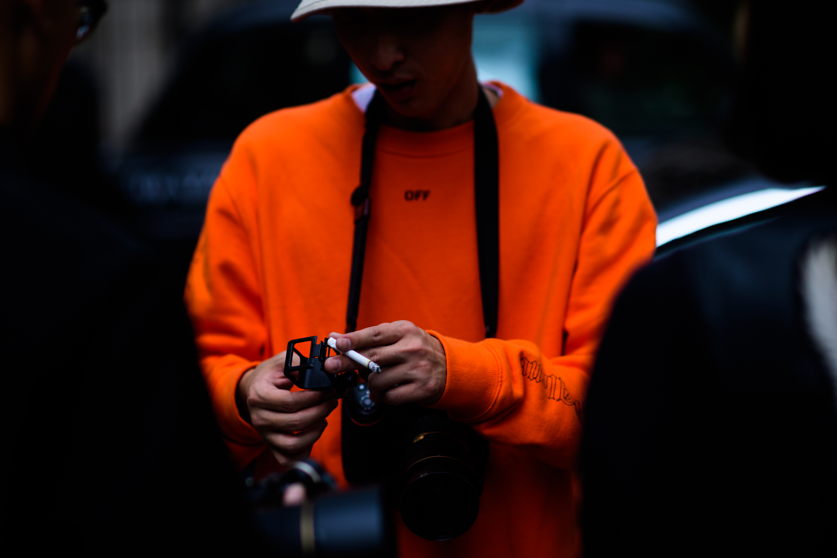Man wearing orange hoodie