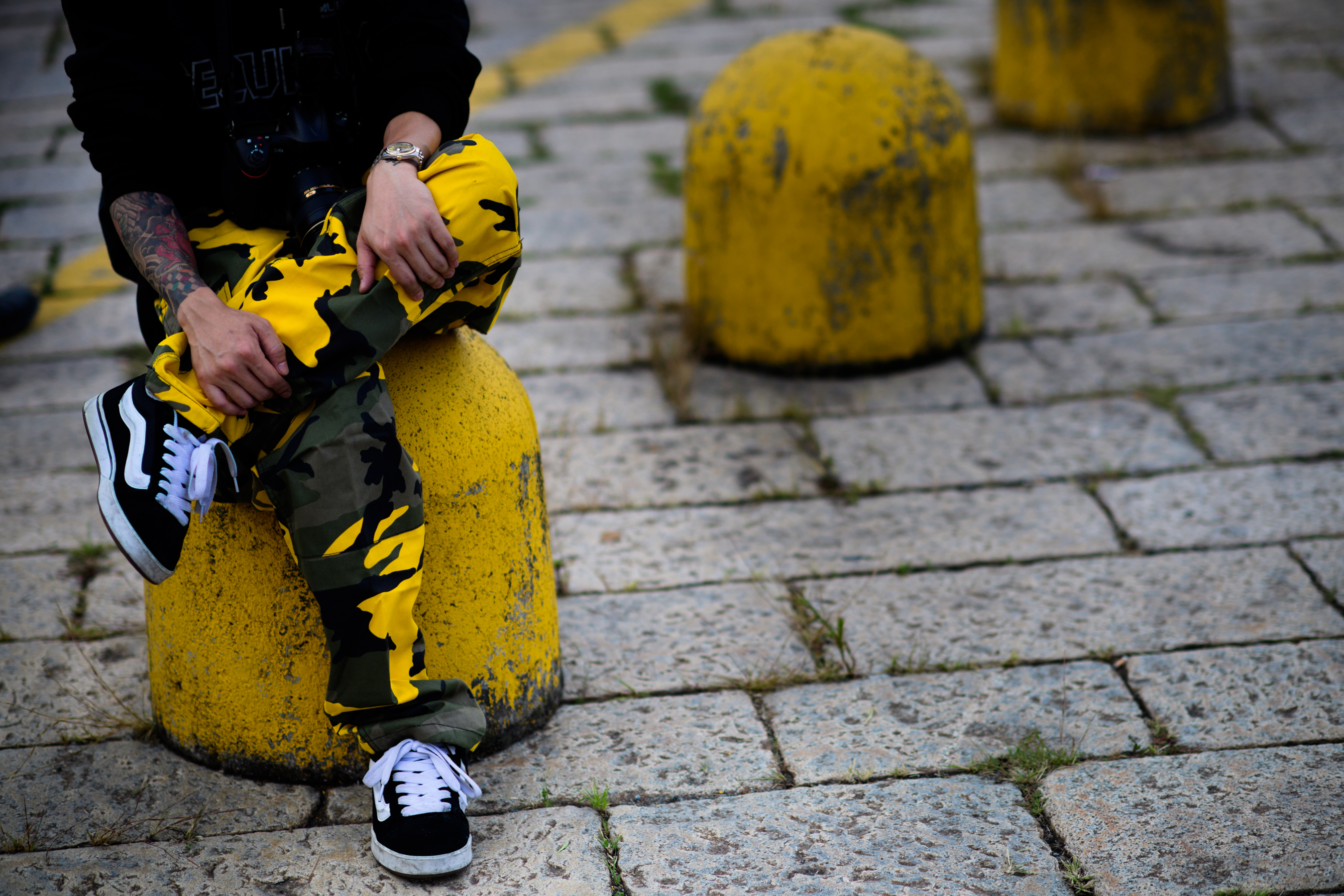 Korean photographer wearing yellow camo pants