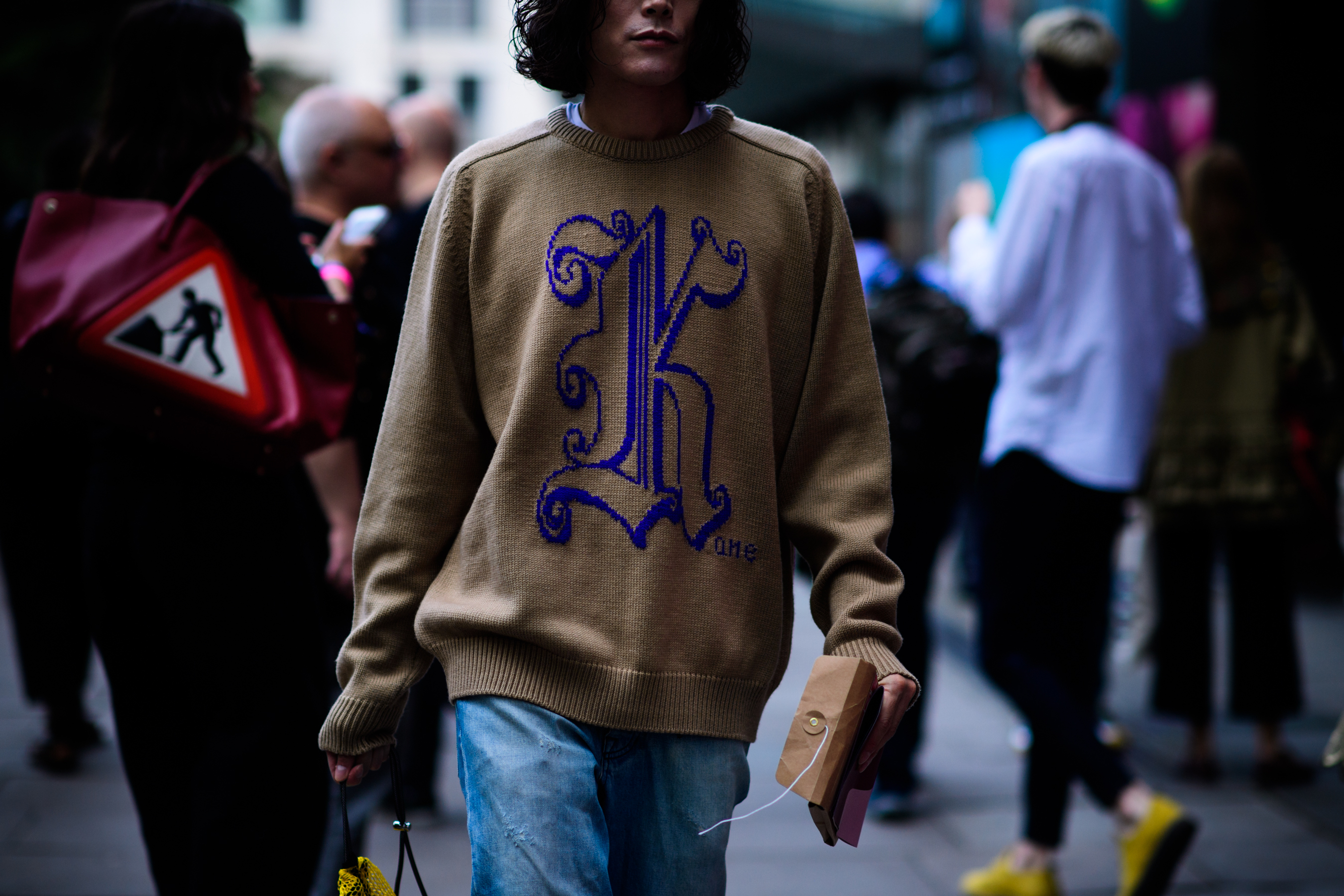 Man wearing brown hoodie