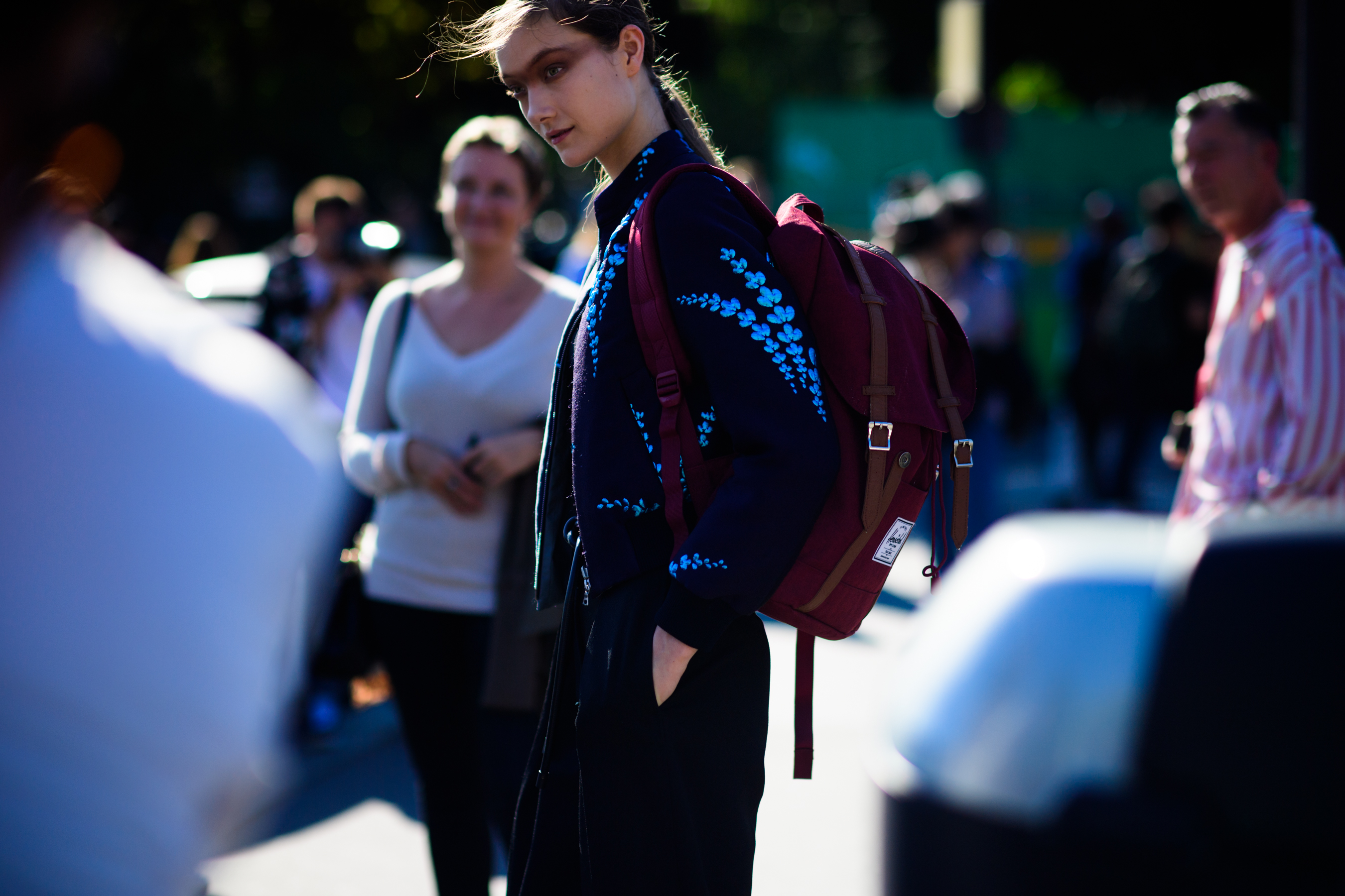 Model with big red back pack