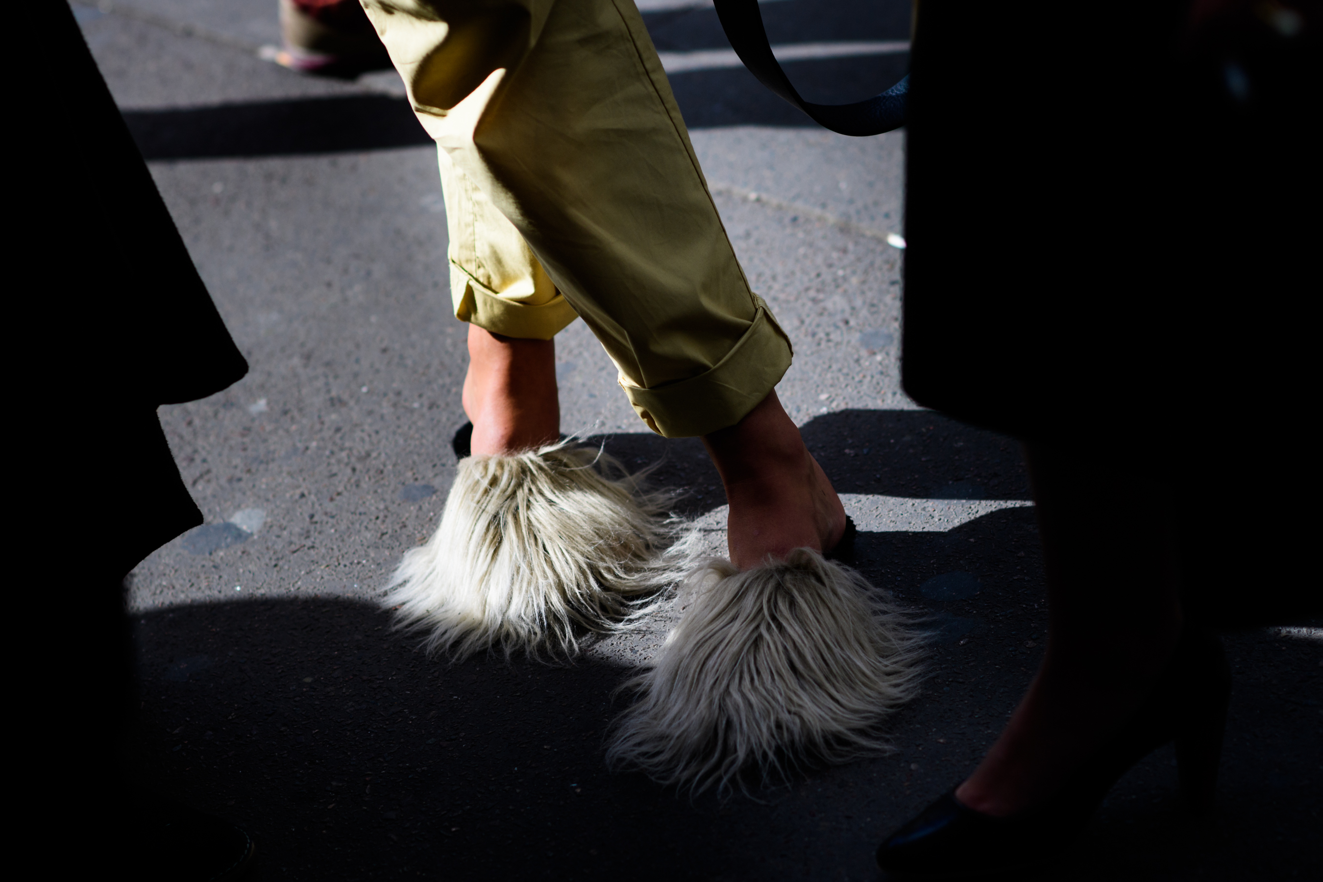 Woman wearing furry sandals