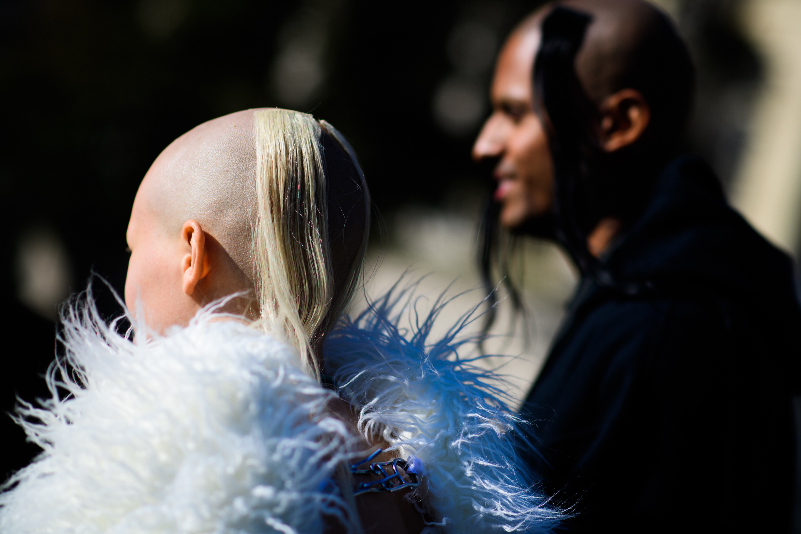 Two people with shaved heads
