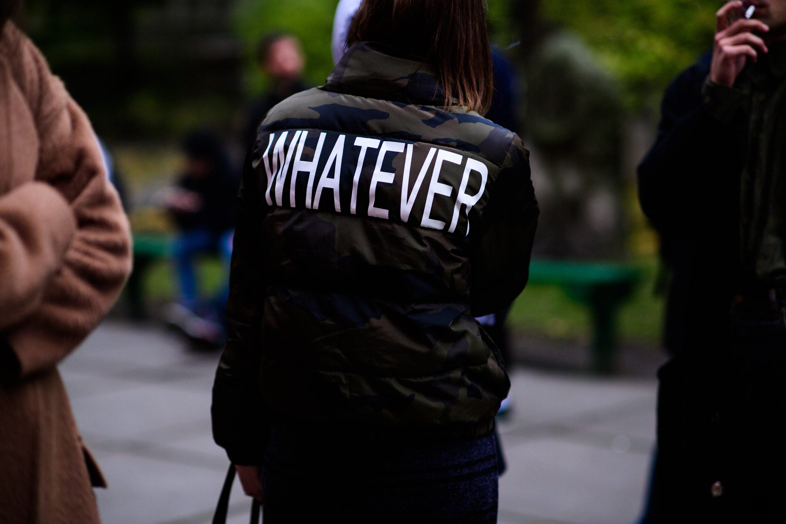 Woman wearing Whatever print jacket