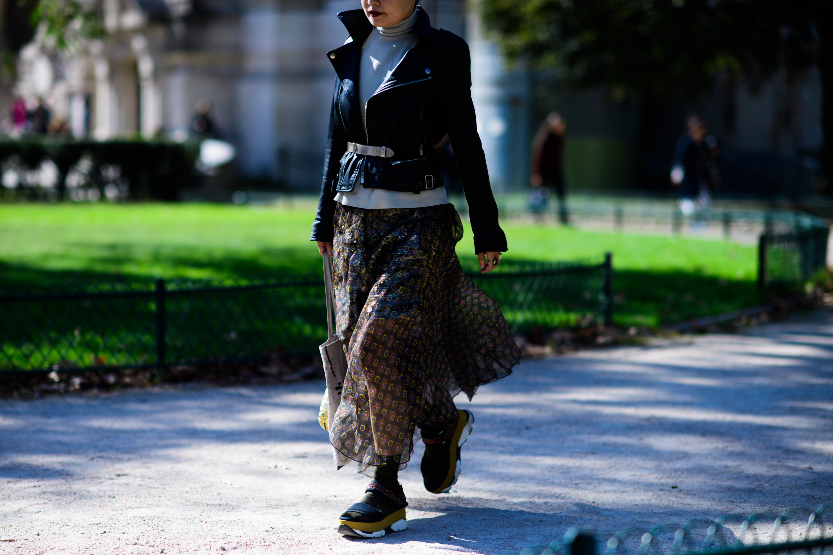 Woman wearing black biker jacket