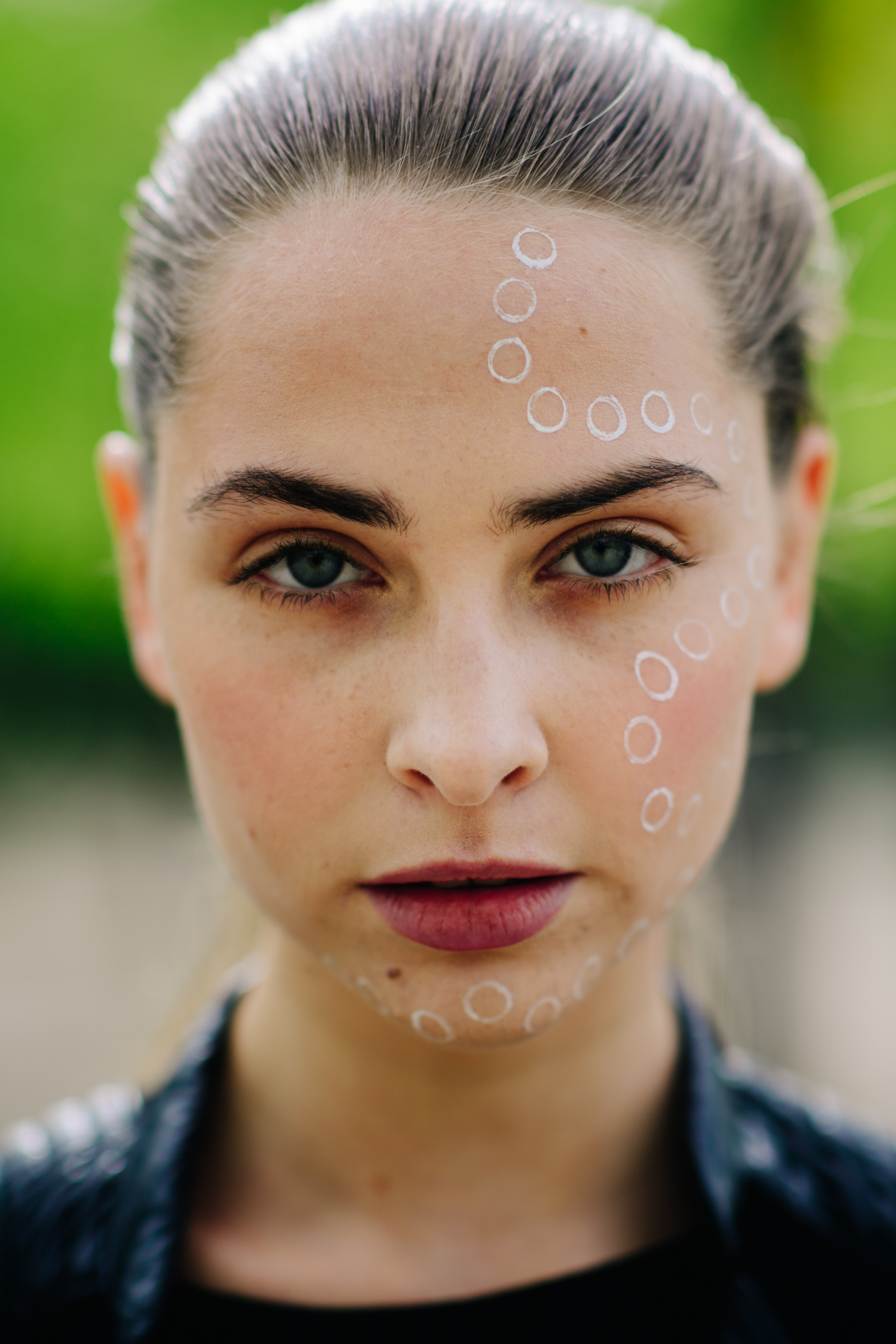 Portrait of model with blue eyes and face makeup