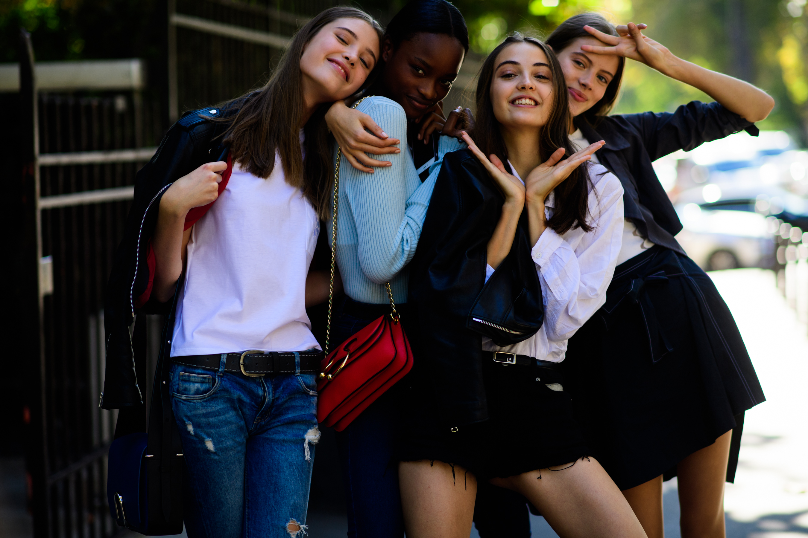 Four models posing after Miu Miu show