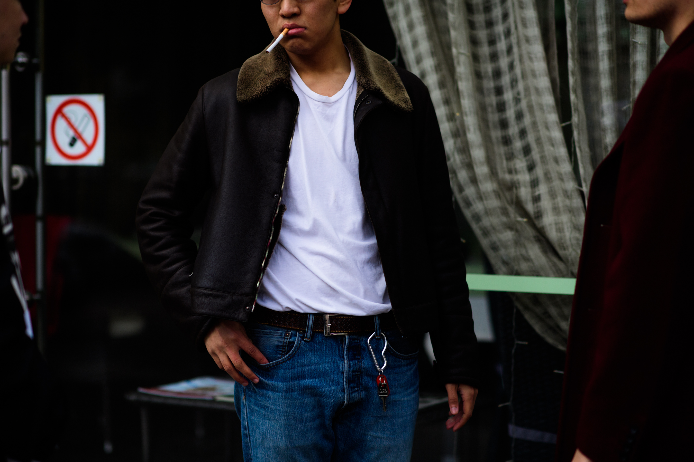 Guy wearing pilot jacket and jeans