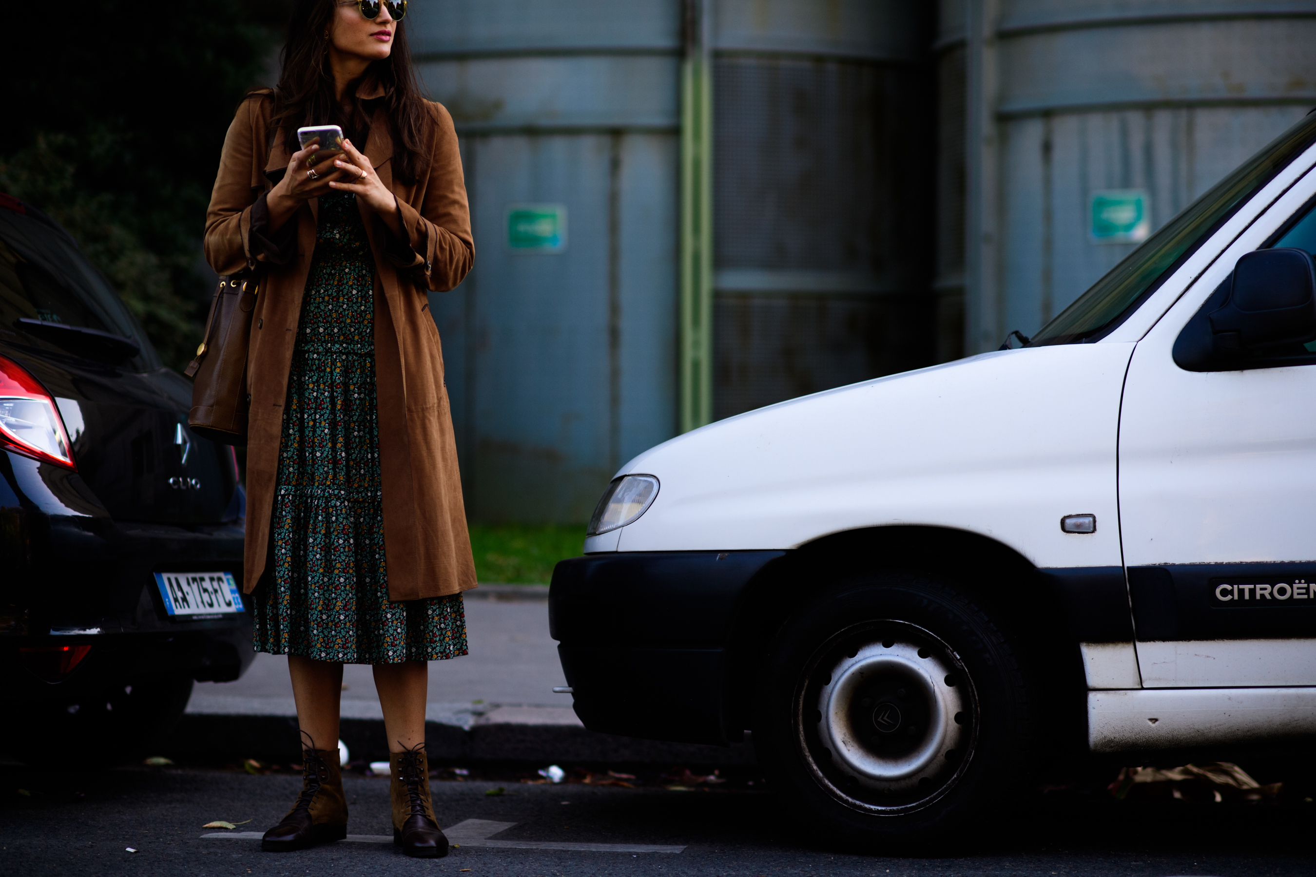 Editor wearing long brown suede coat