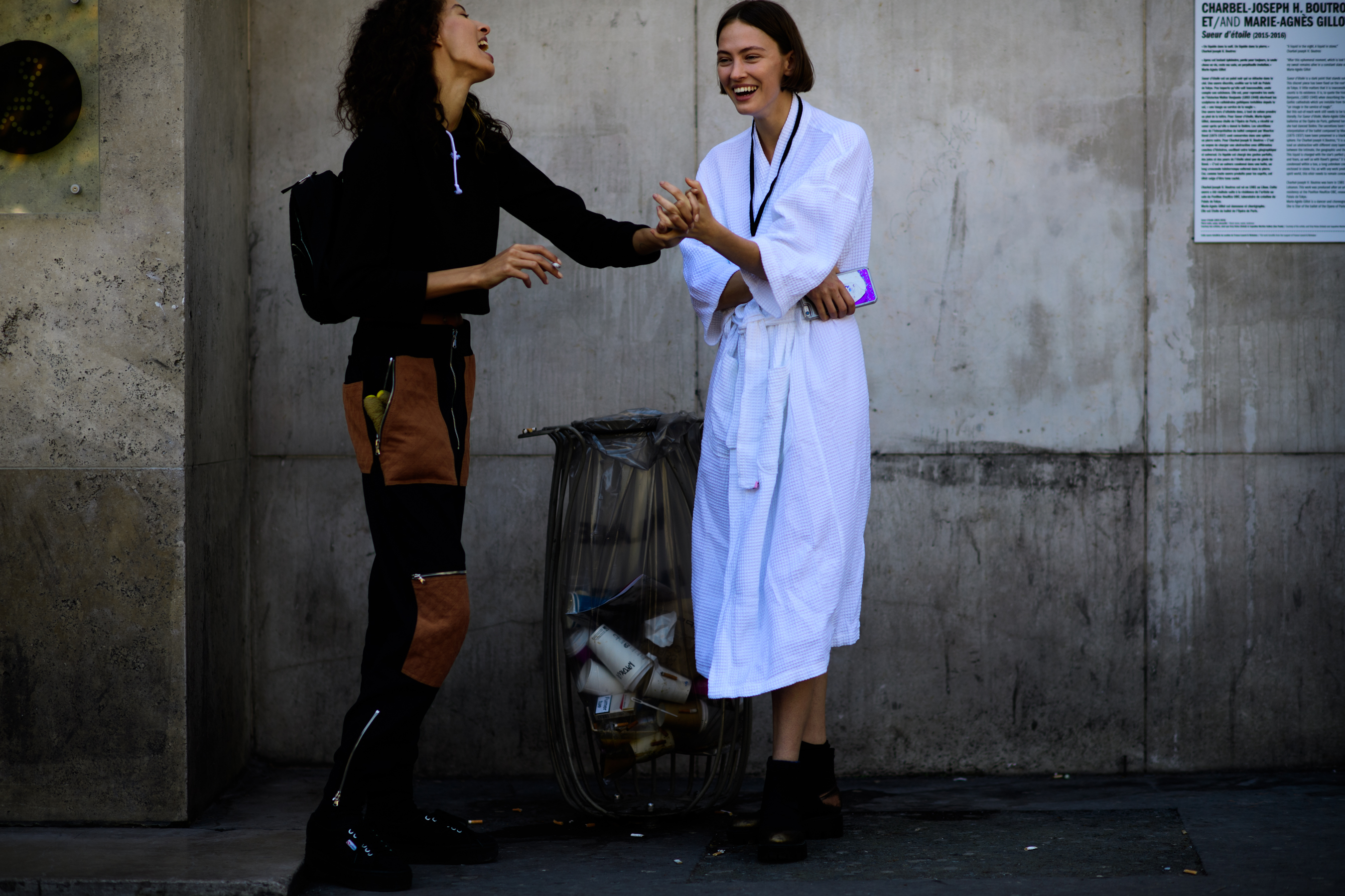 Two models smoking outside