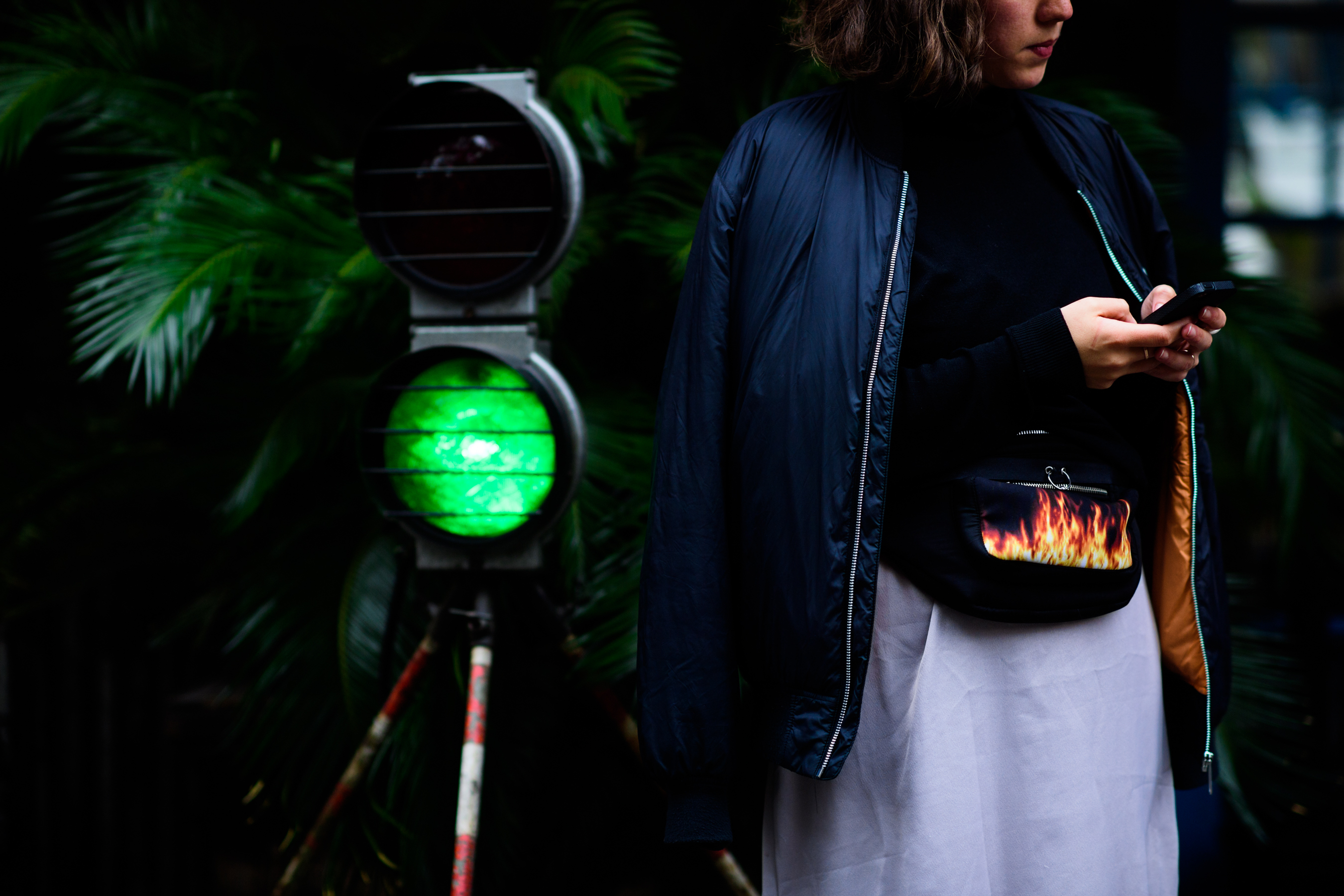 Russian journalist wearing black bomber