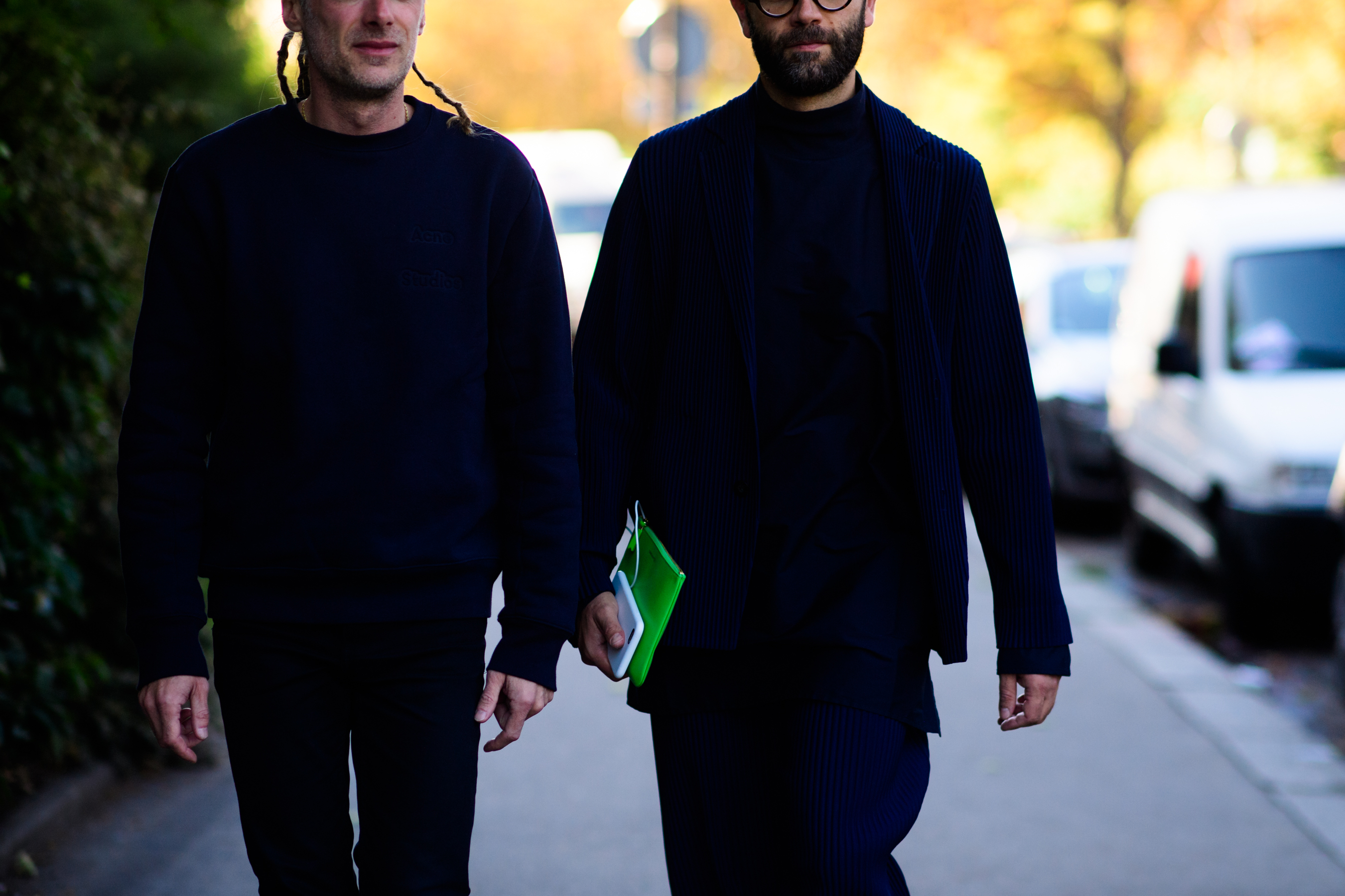 Two men wearing dark colours