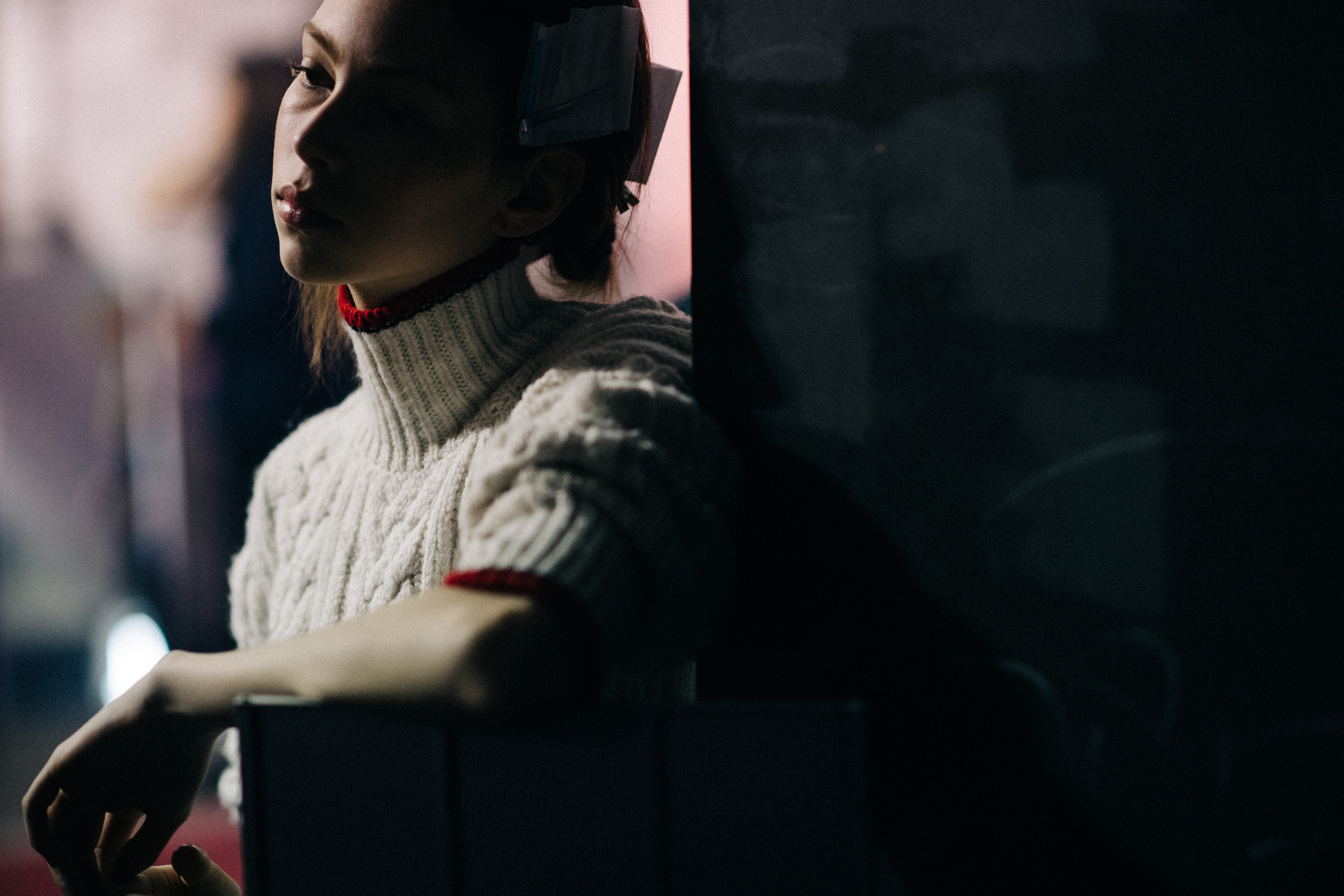 Model wearing white sweater
