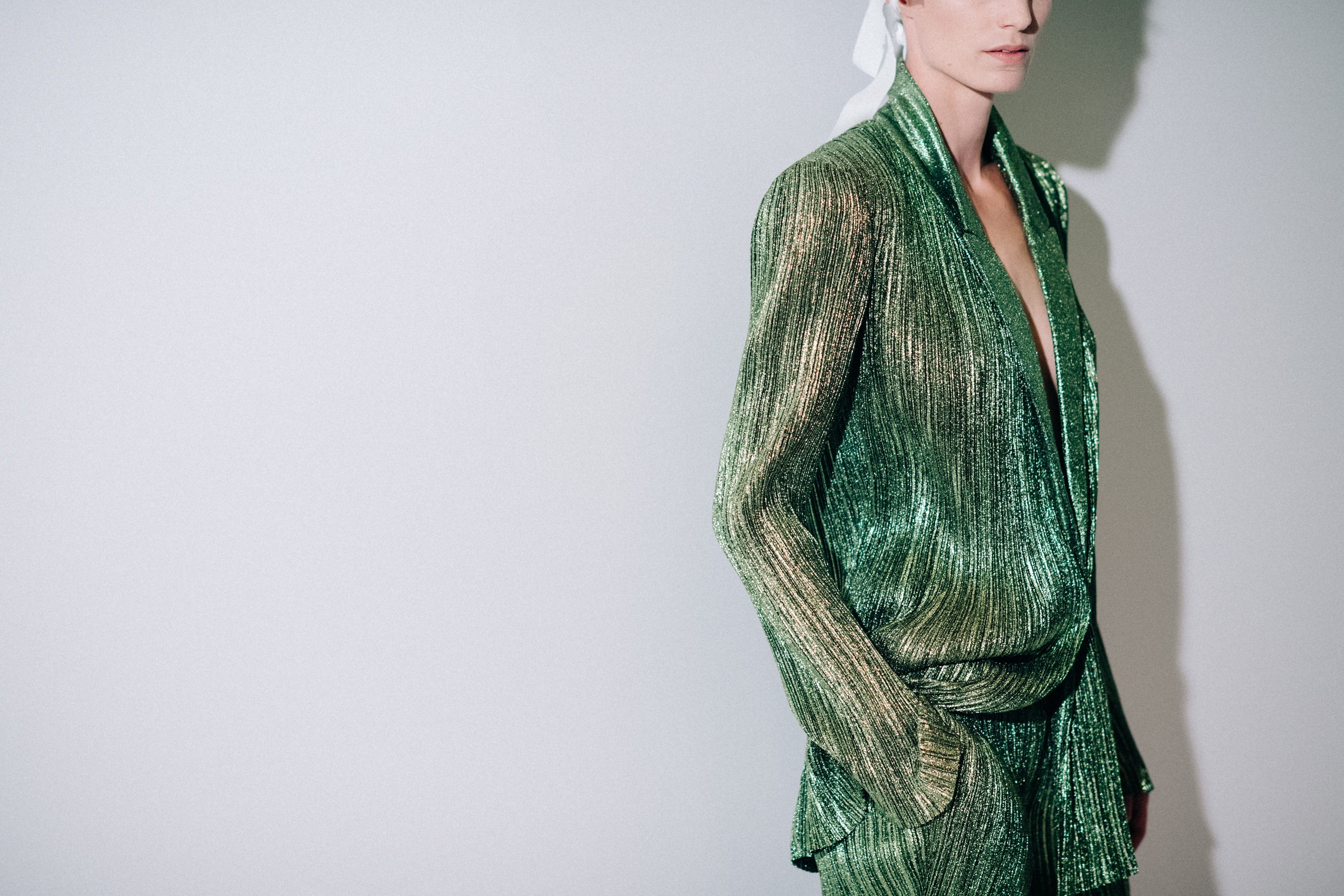 Model wearing green suit