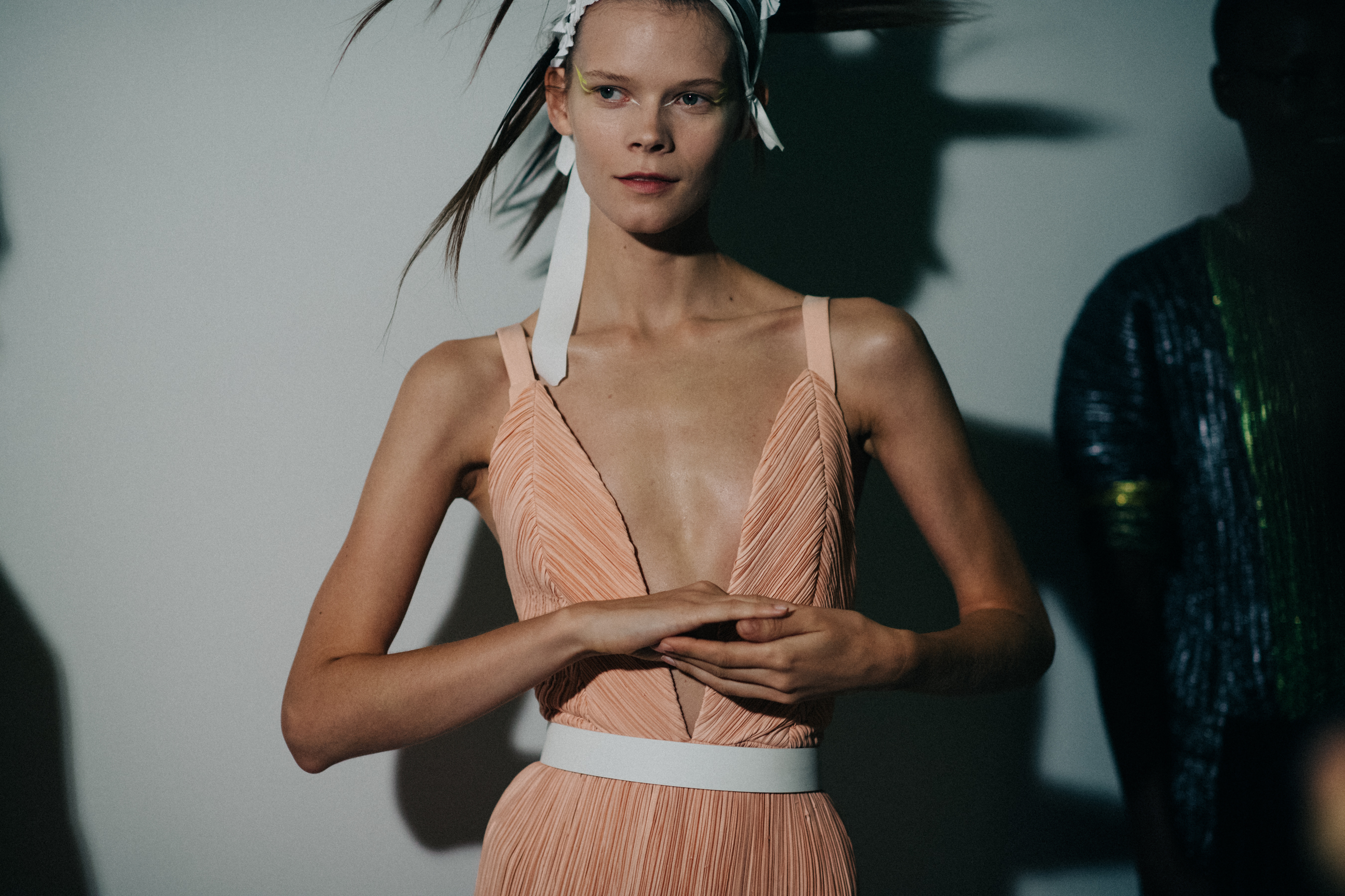 Ukrainian model wearing peach dress