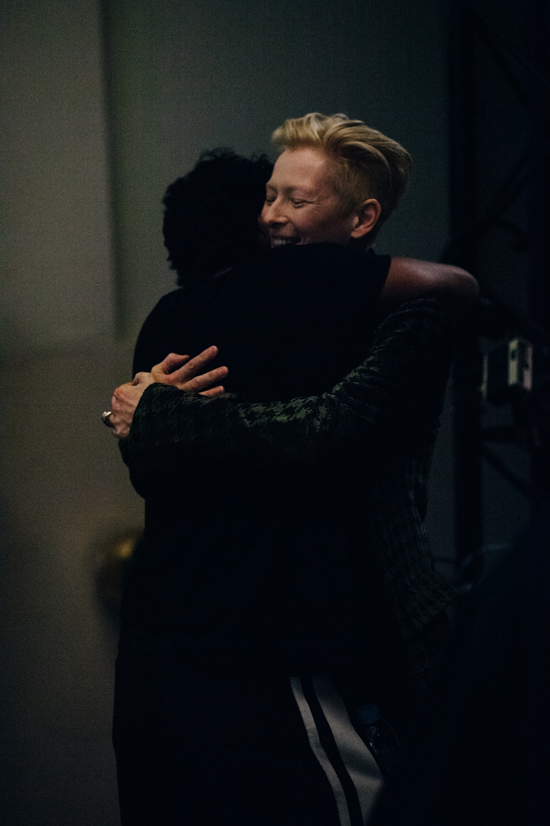 Tilda Swinton giving designer a hug
