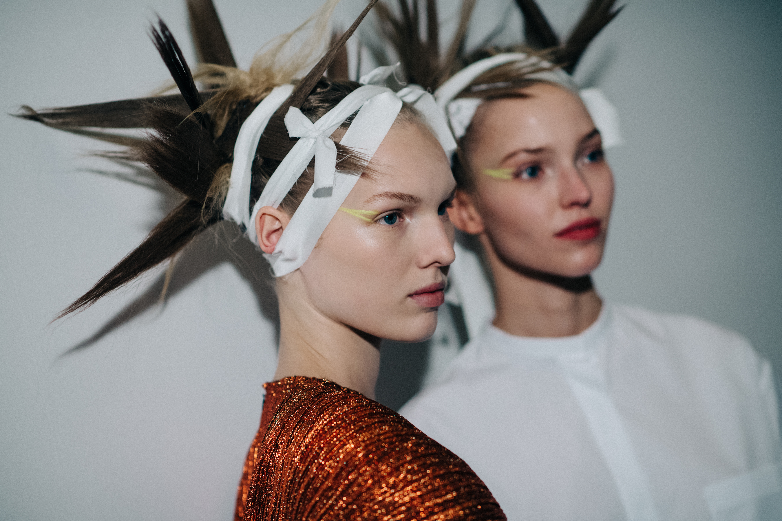 Two models with crazy hair do