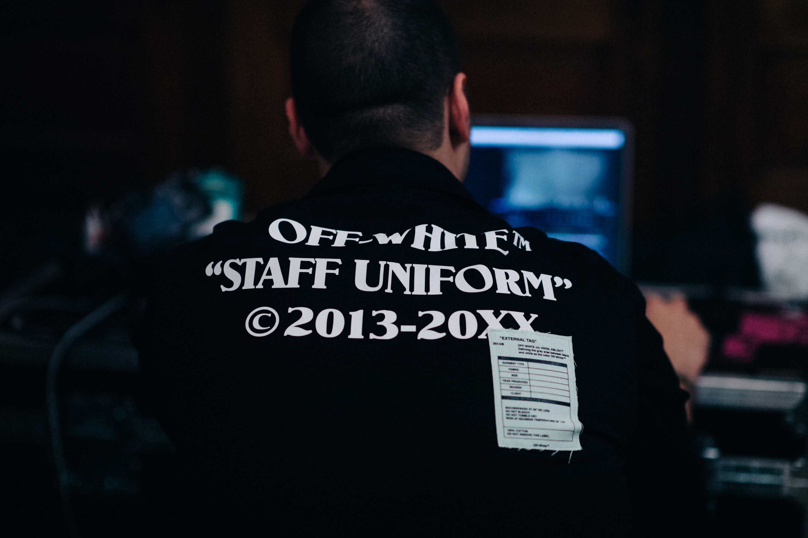Staff member wearing workwear jacket