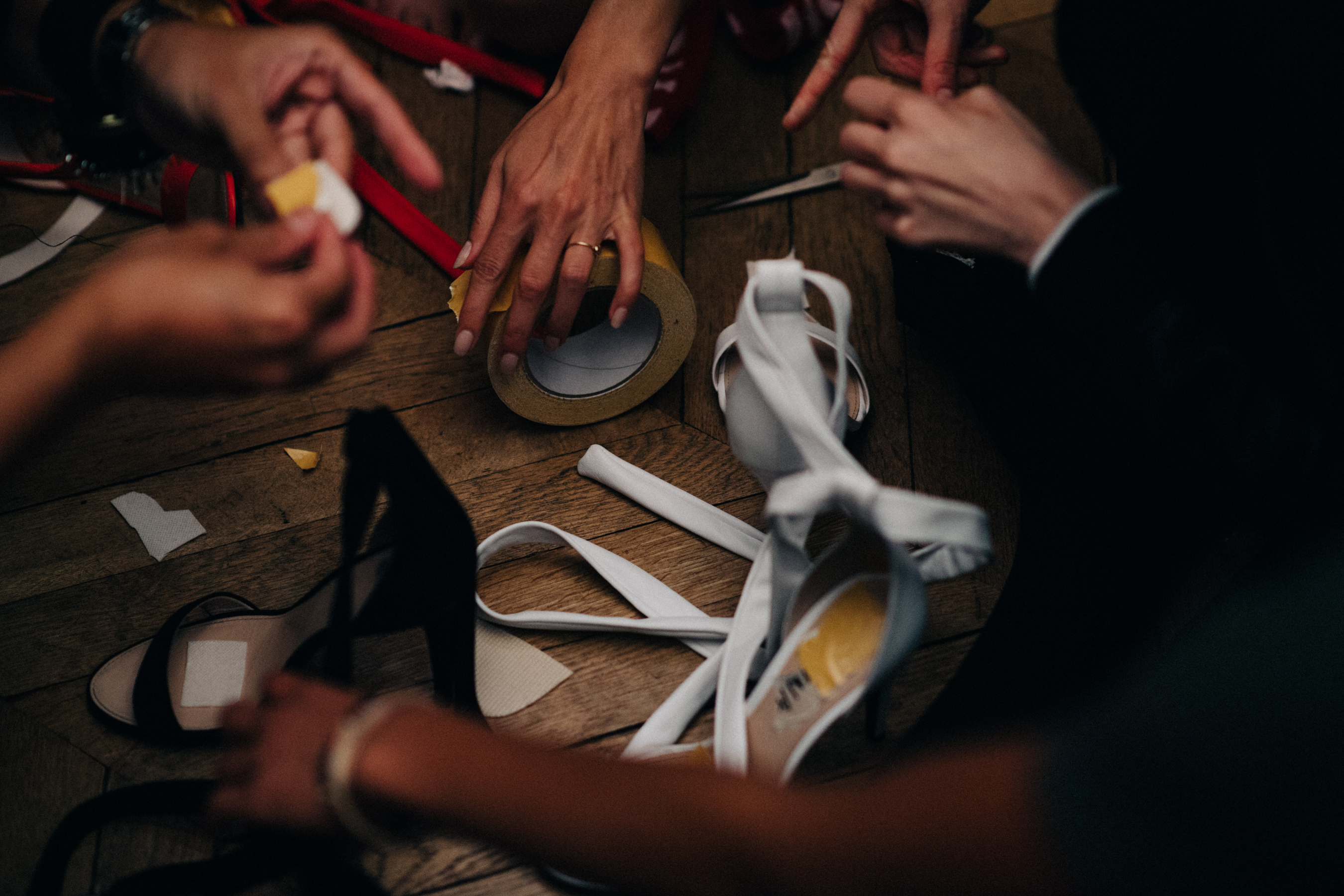 Dressers taping shoes before the show