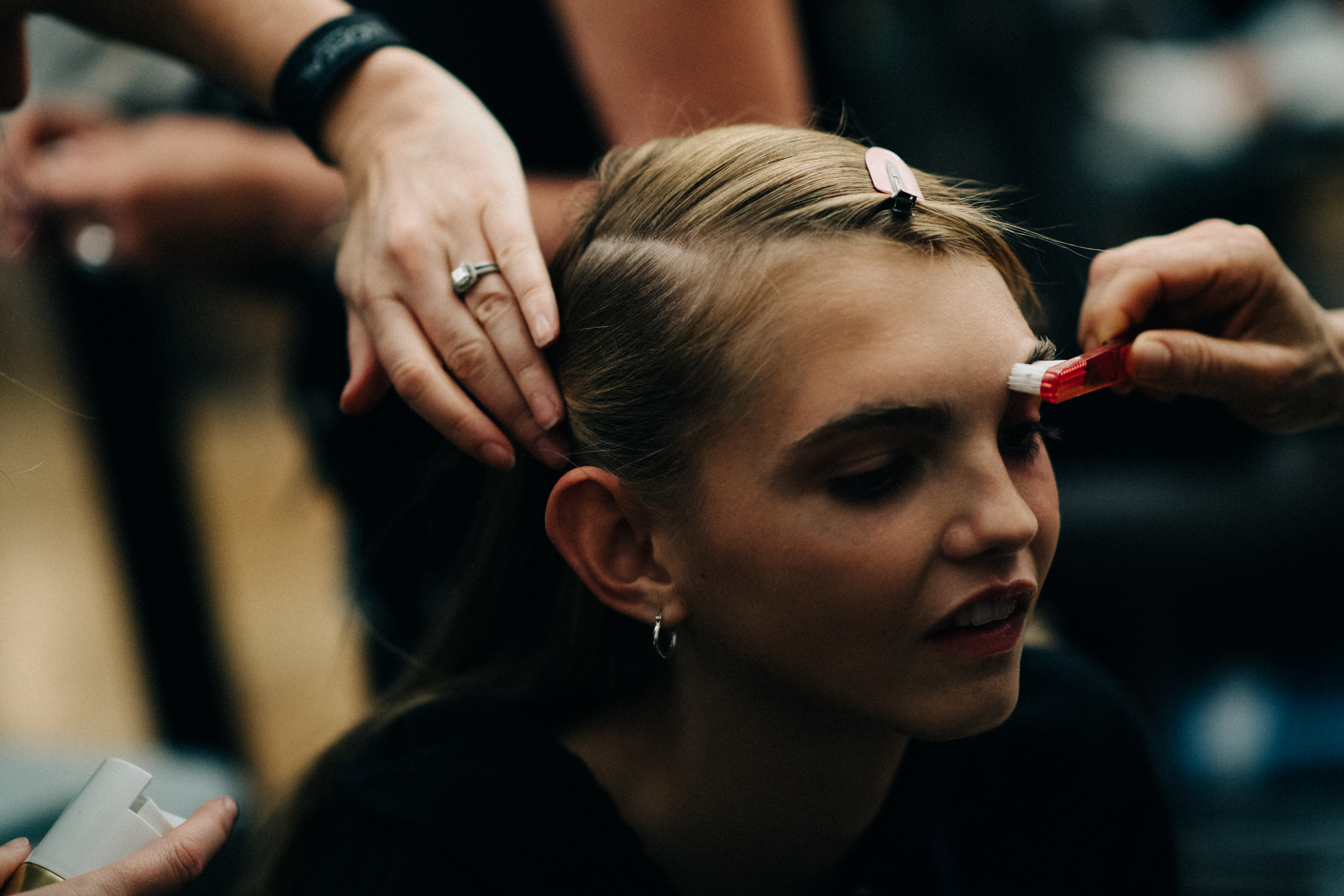 Model Molly Bair getting make up done