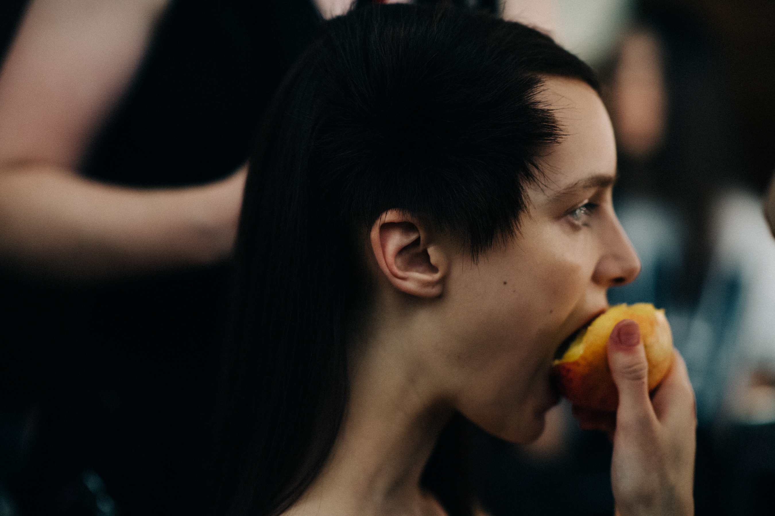Model Irina Liss eating peach