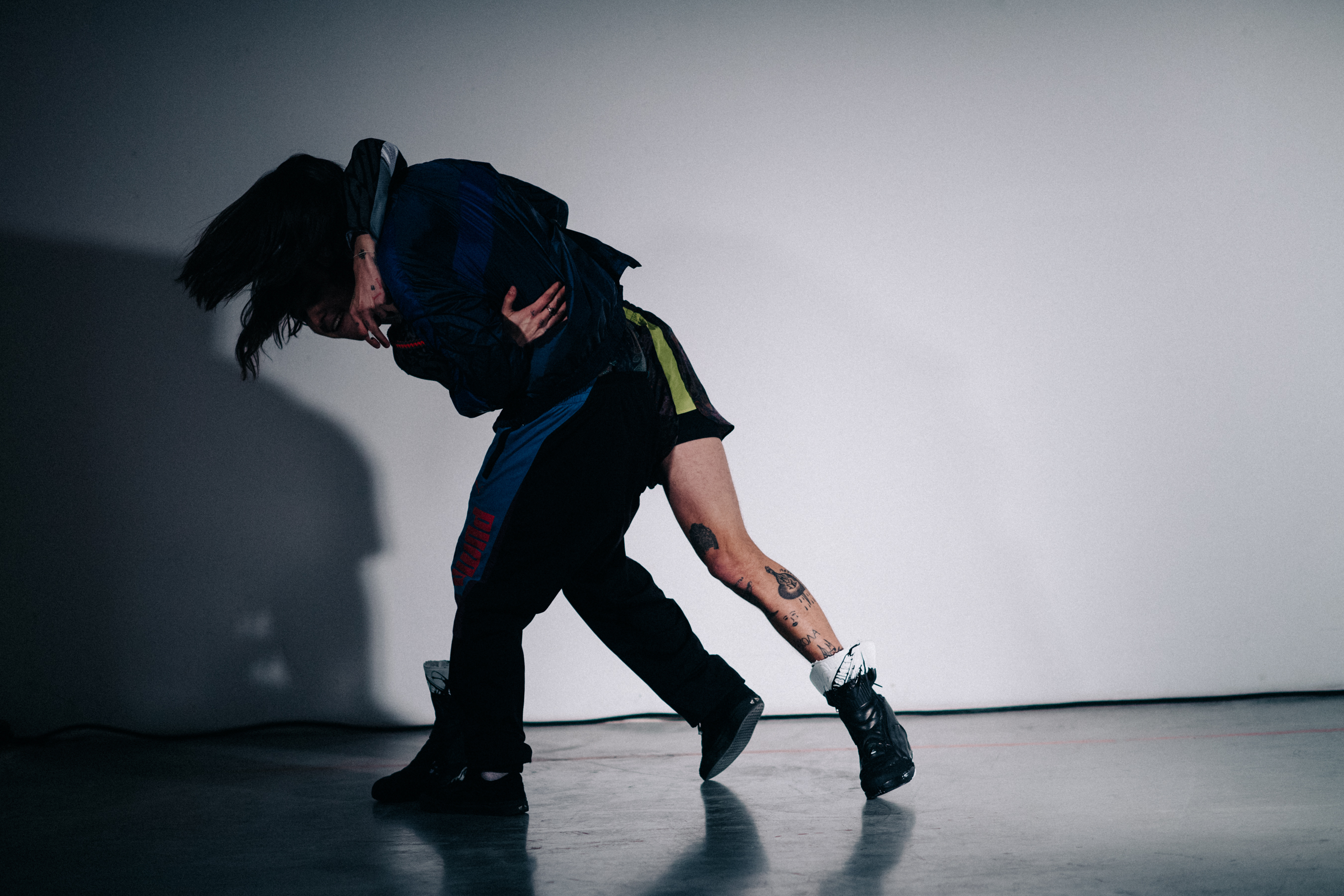 Male models wrestling before the show