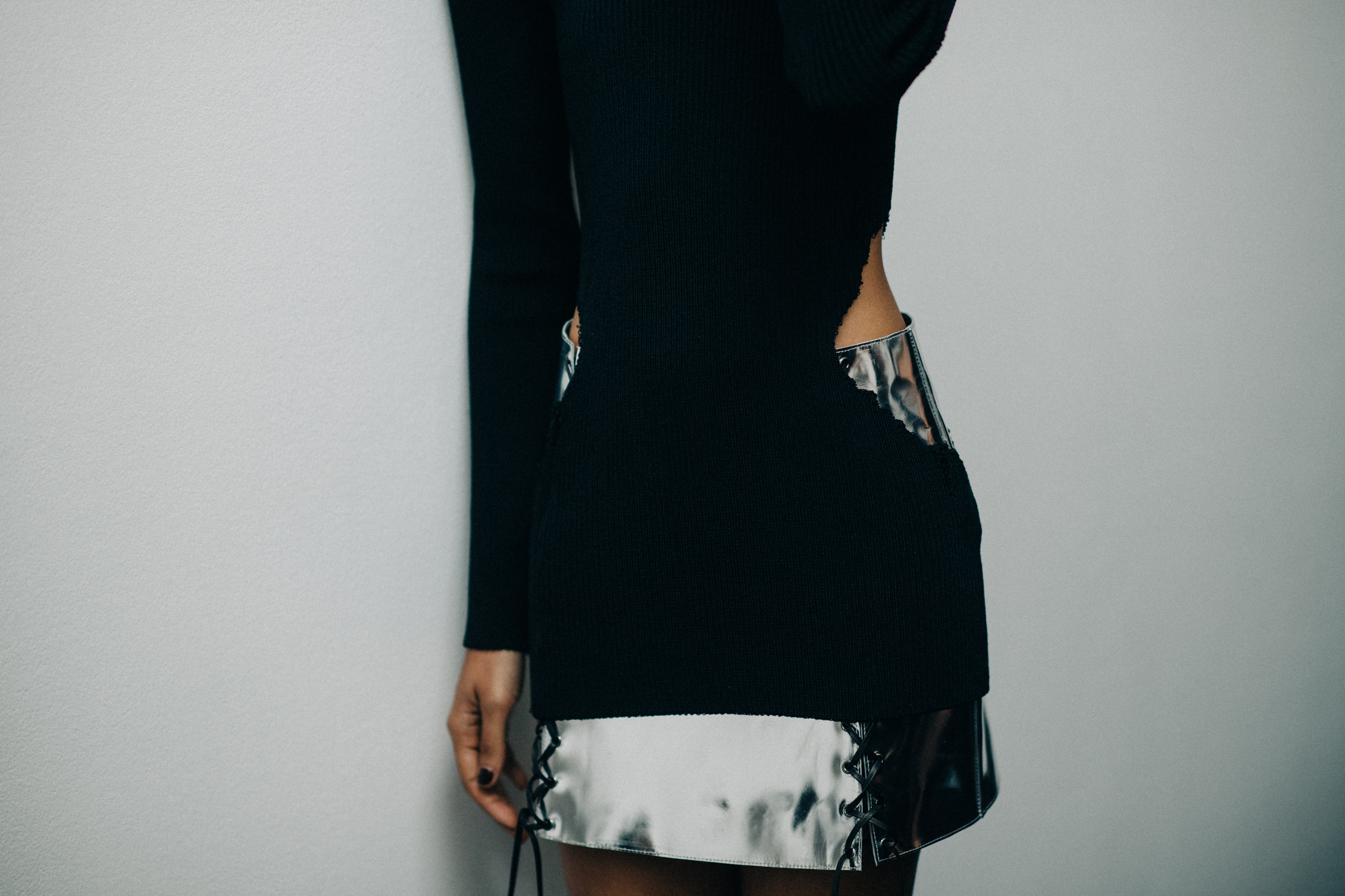 Model wearing silver leather skirt
