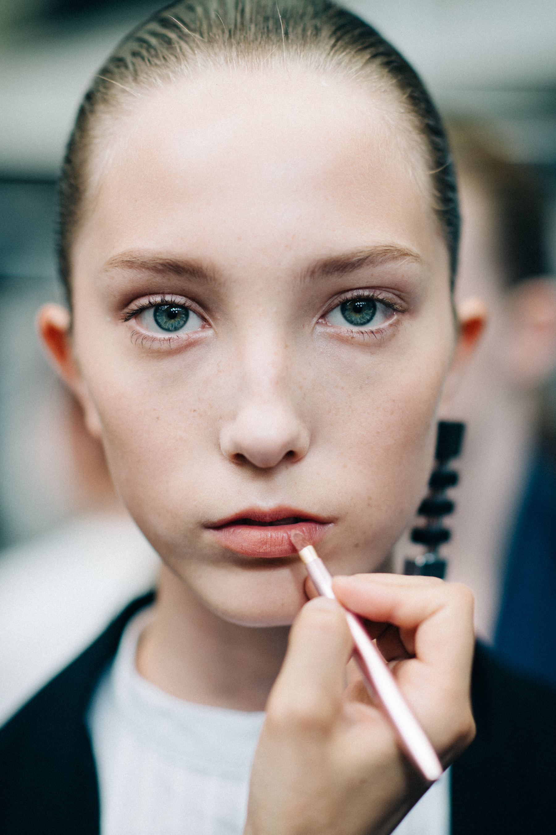 Portrait of model with brush lipstick