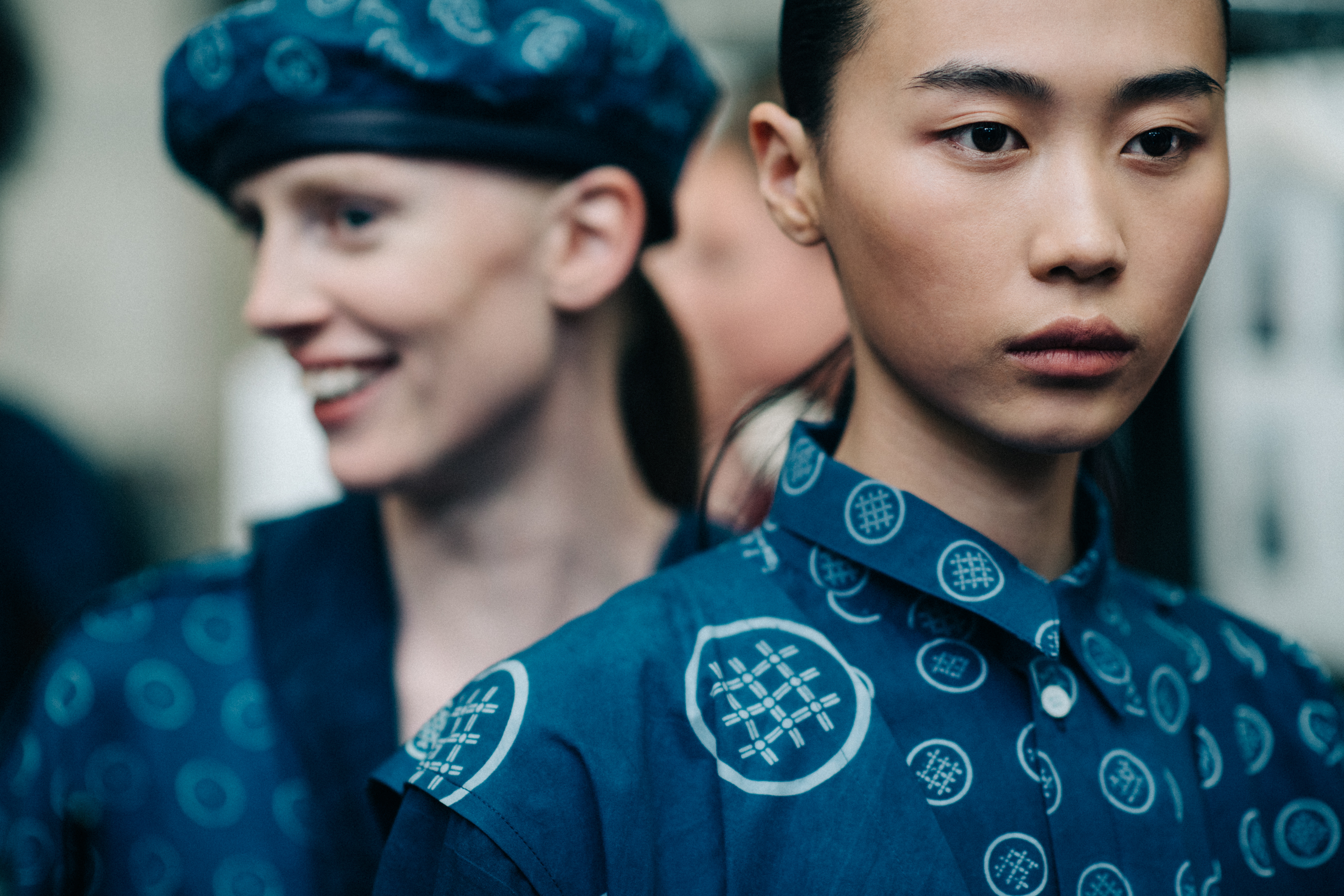 Two models wearing blue look