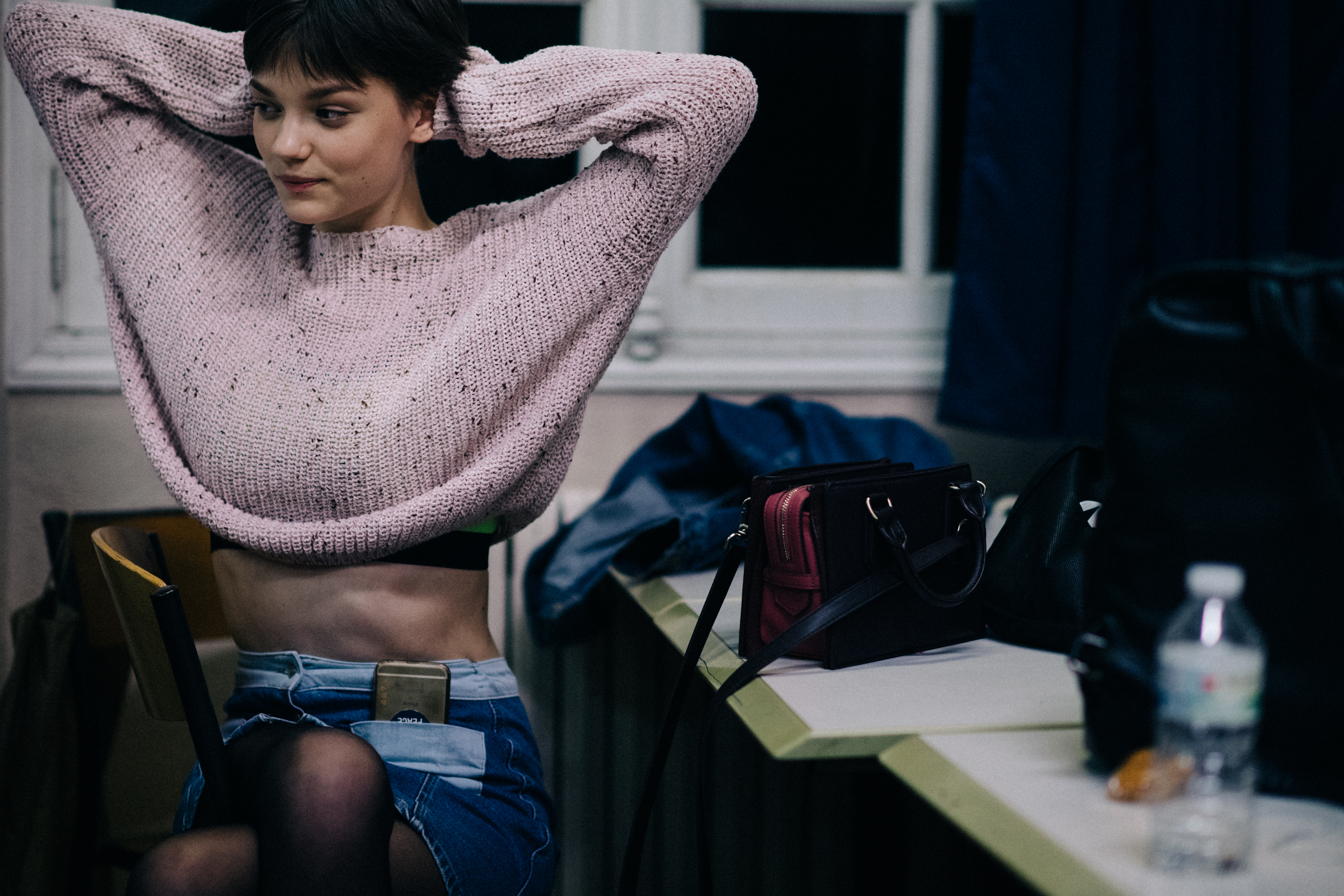 Model wearing pink sweater