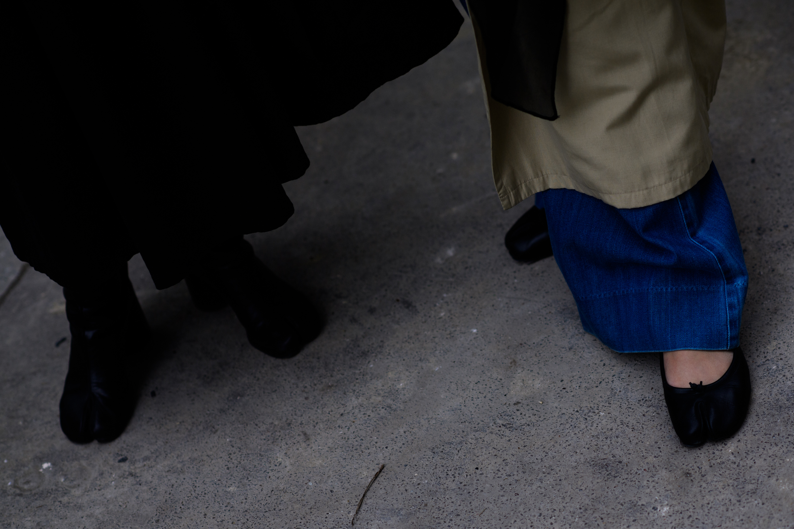 Closeup of two womens feet in ballet shoes