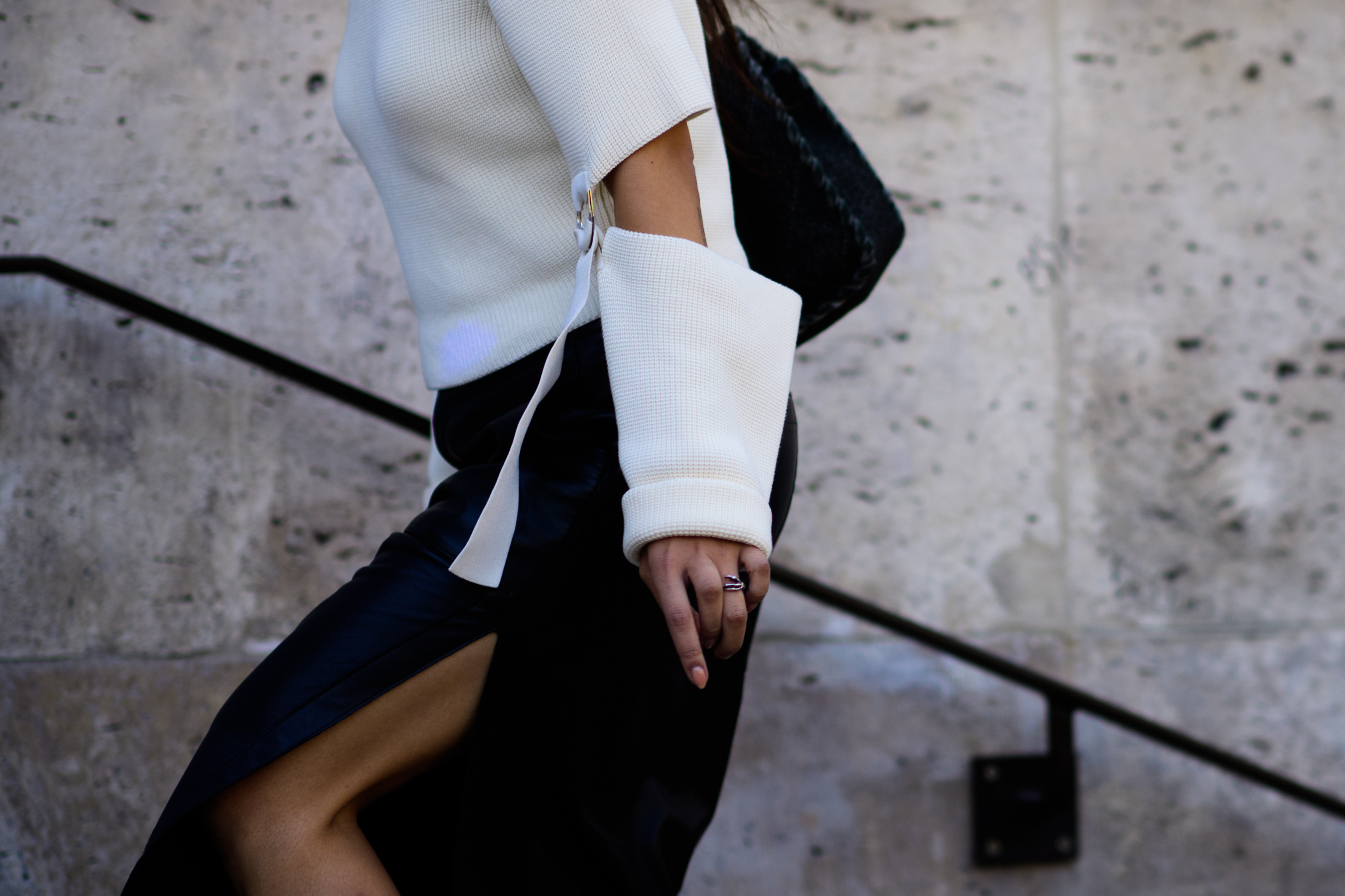 Closeup of woman in white knit jumper