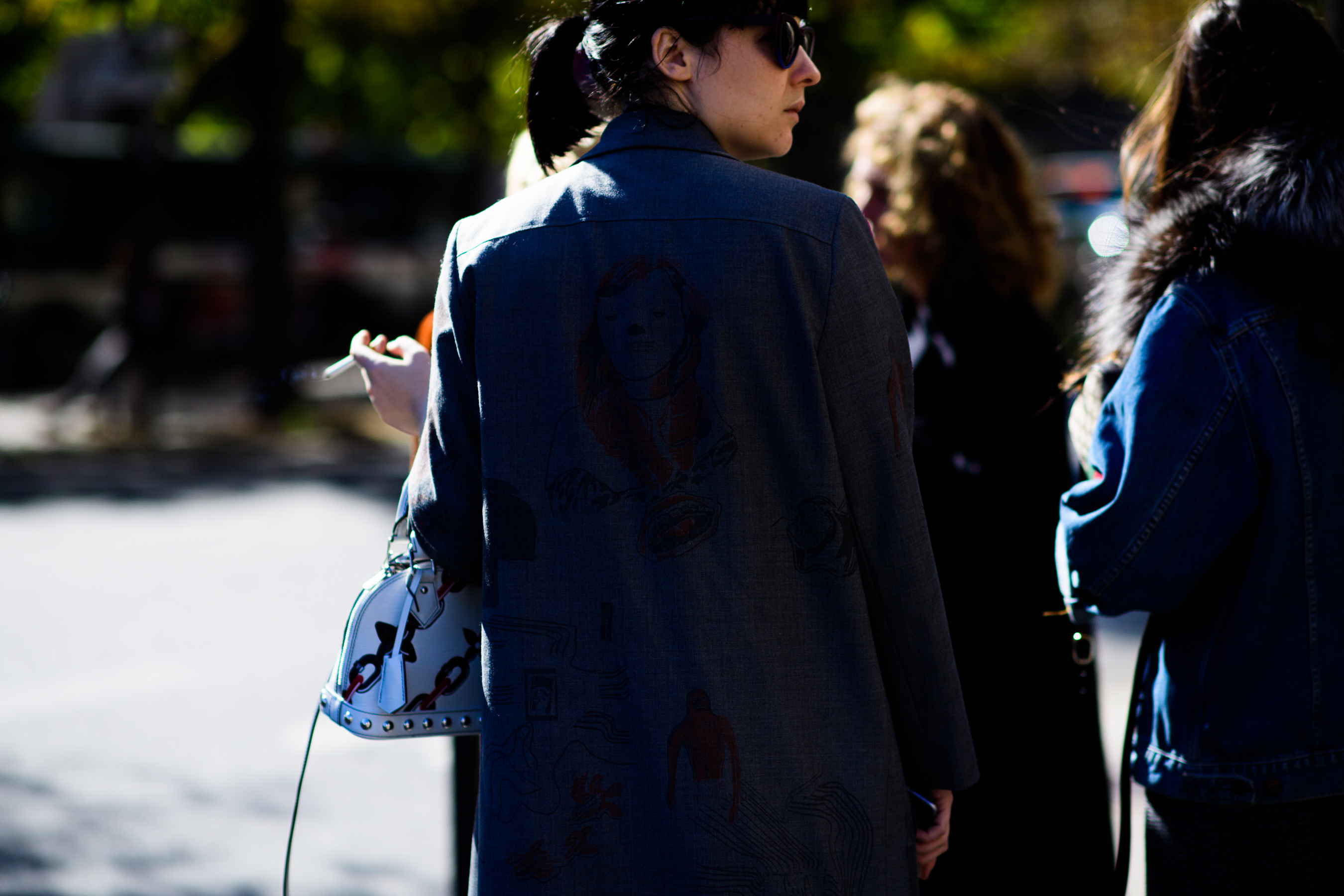 Rear of woman wearing back graphic shirt