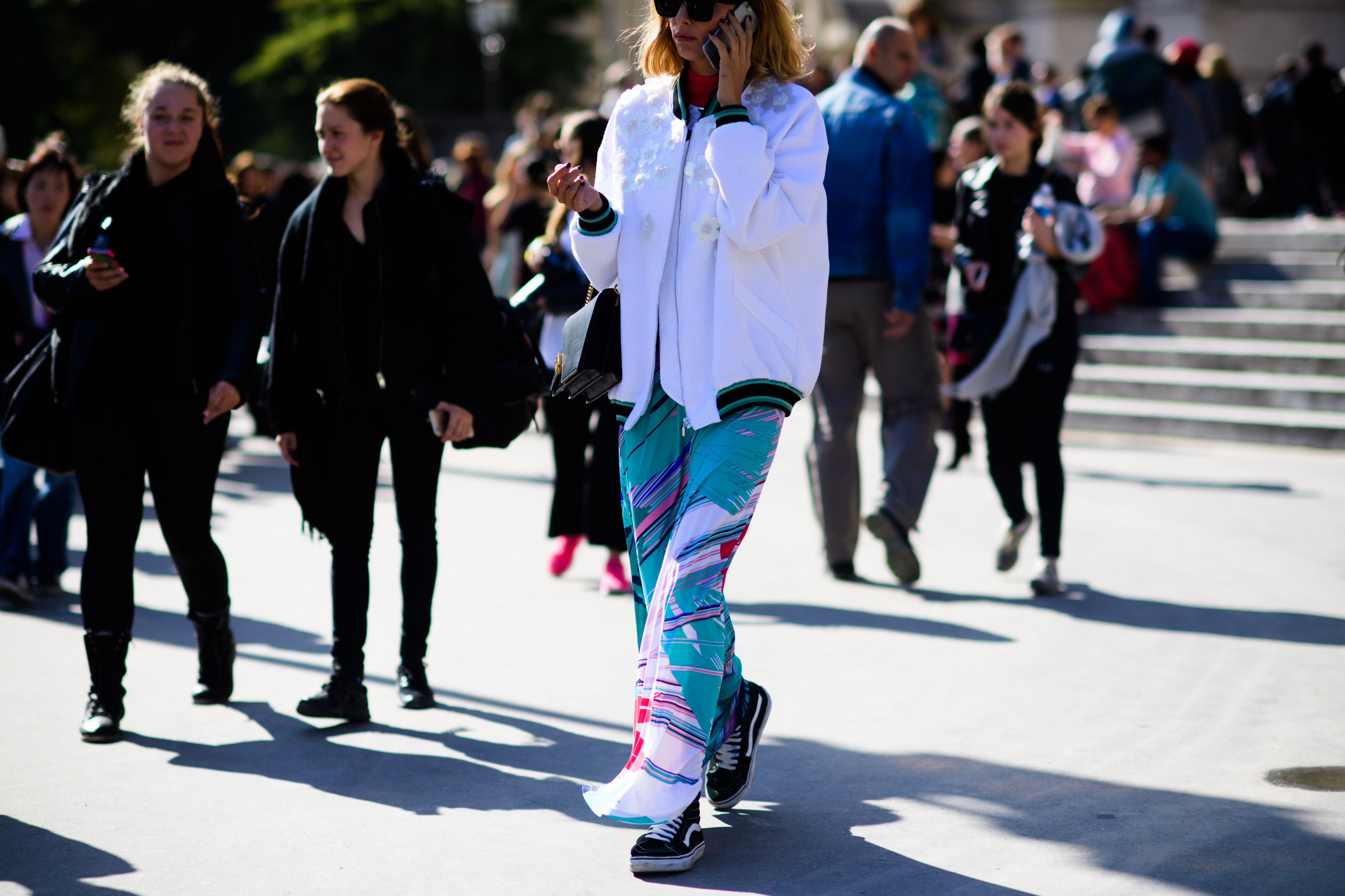 Blogger walking in floral jacket