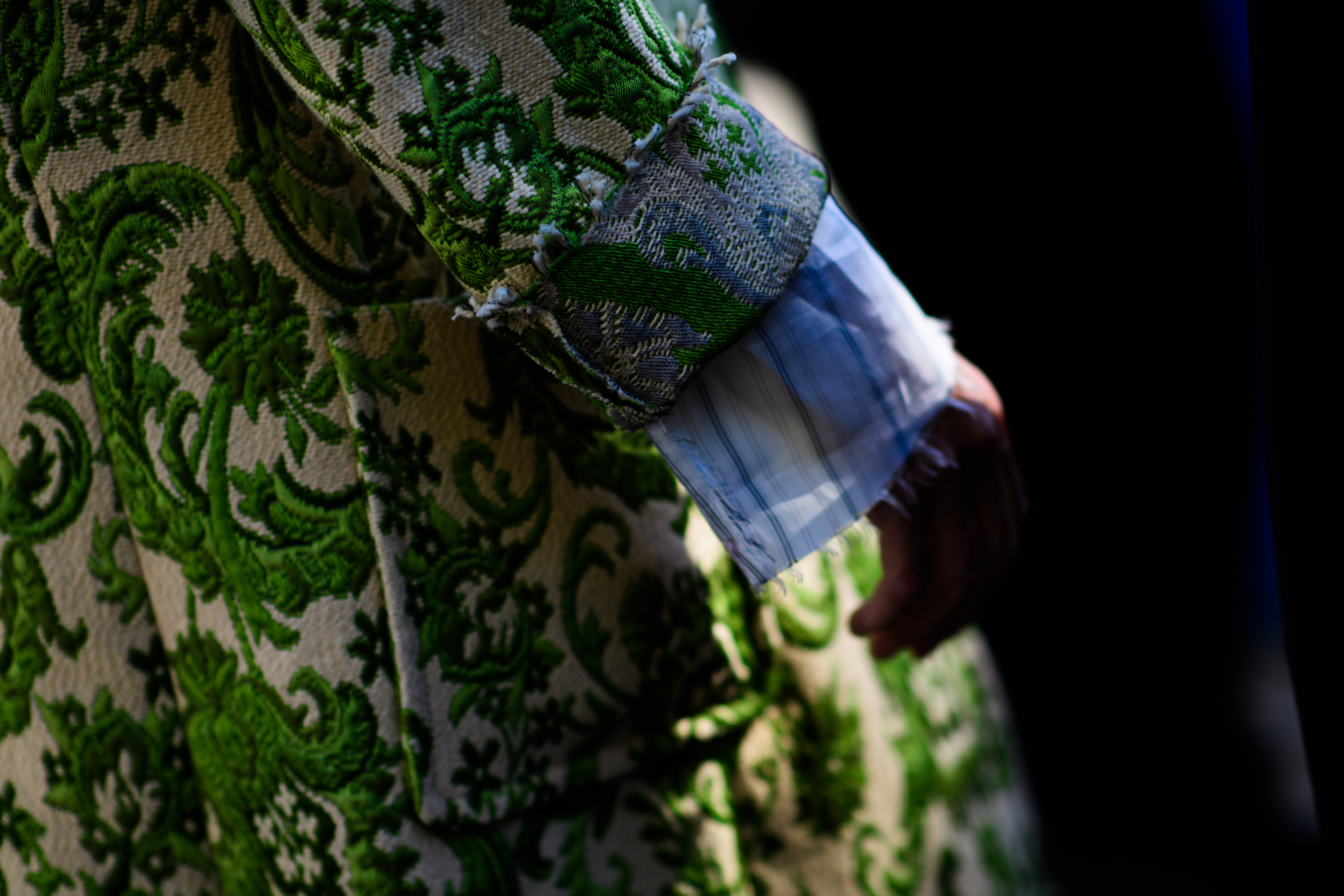 Closeup of womans sleeve in green coat