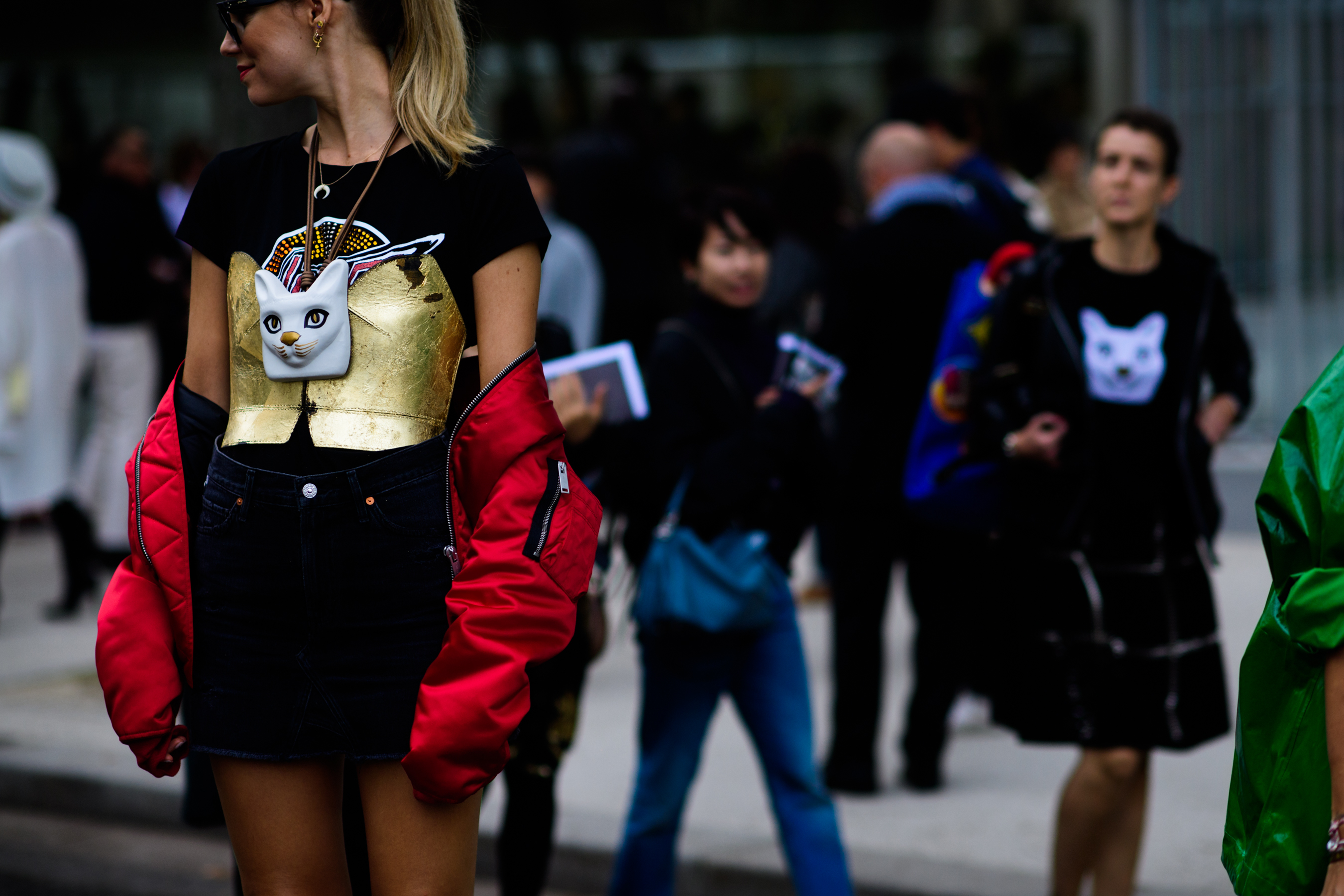 Italian blogger wearing gold corset over black graphic tee