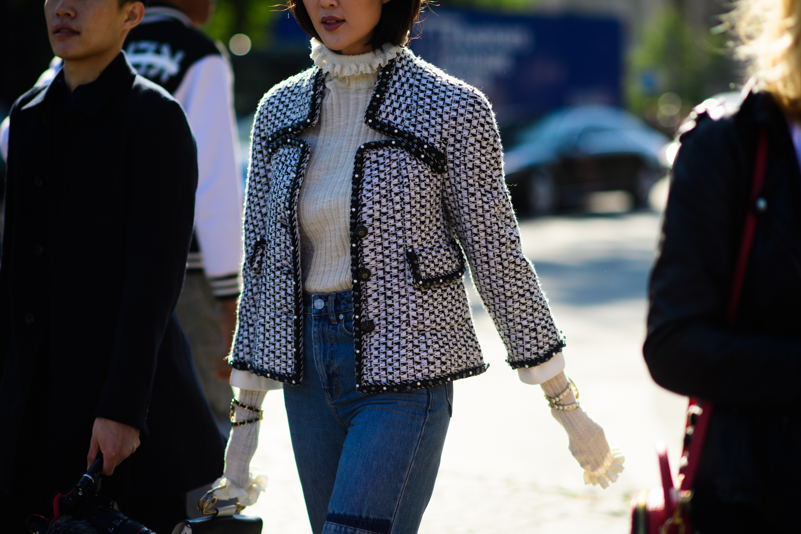 Blogger wearing white jacket and top