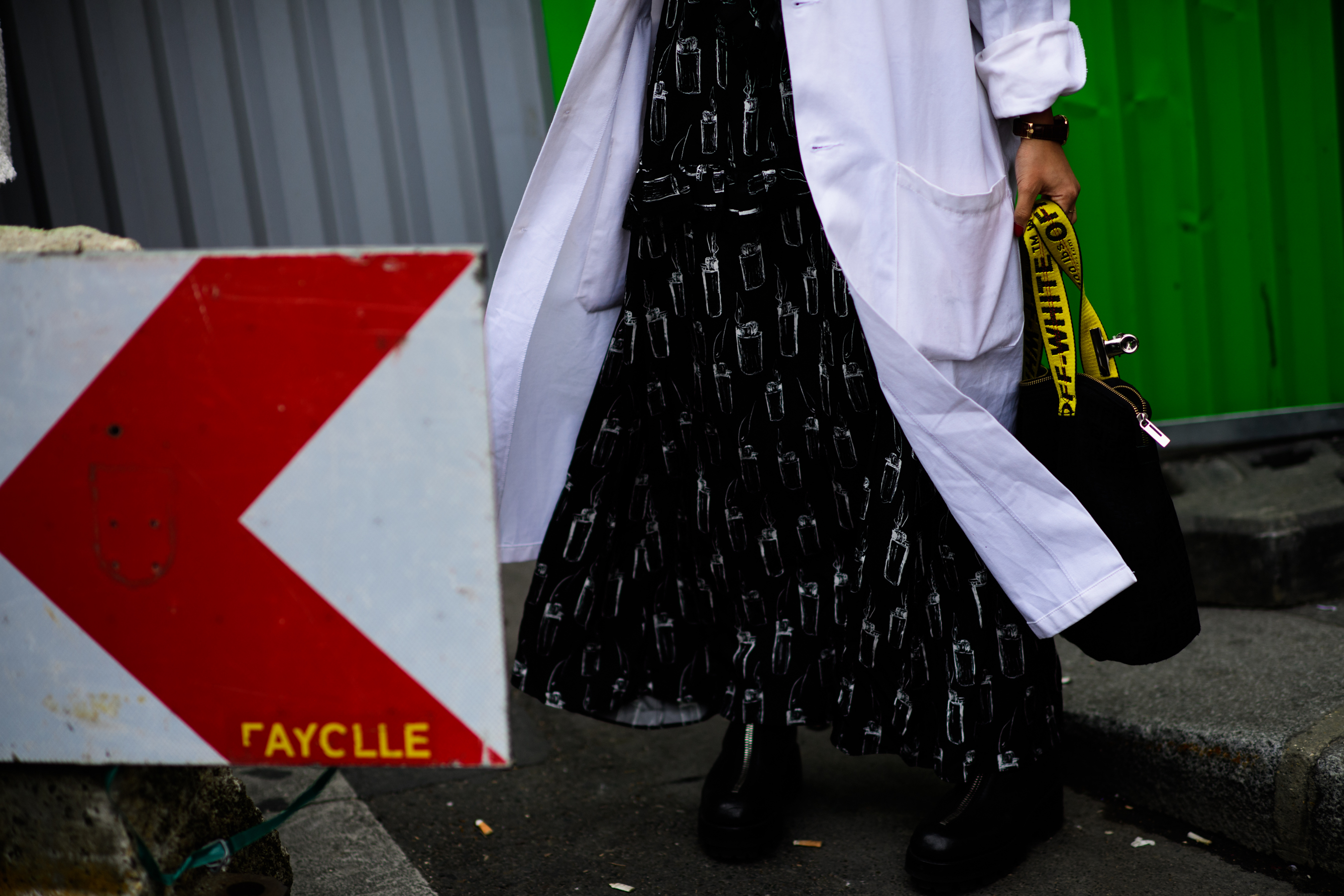 Closeup of American stylist in white worker coat