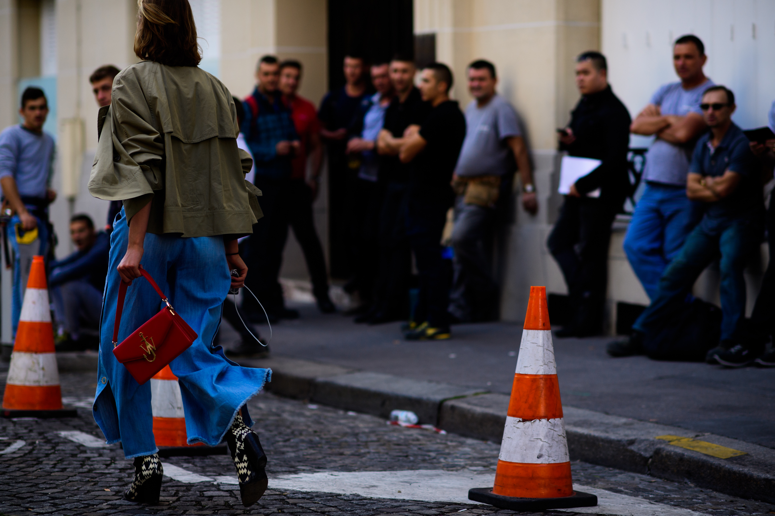 Rear of woman holding red handbag