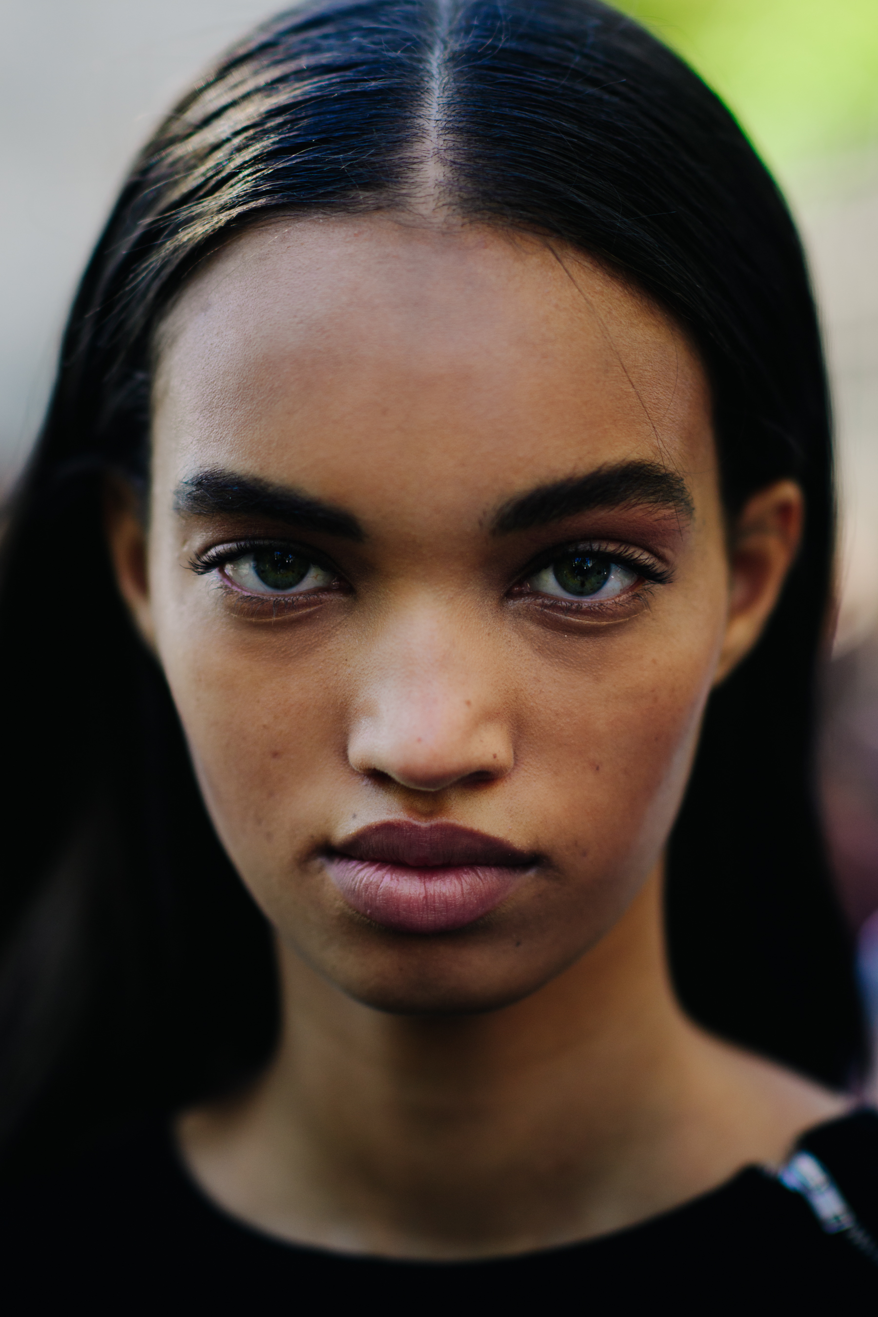 Portrait of model with green eyes and dark hair